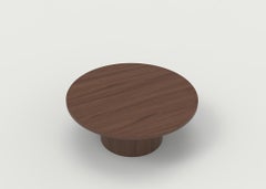 Wood Coffee Table with Round Base and Painted Cylindrical Posts Shown in Oak