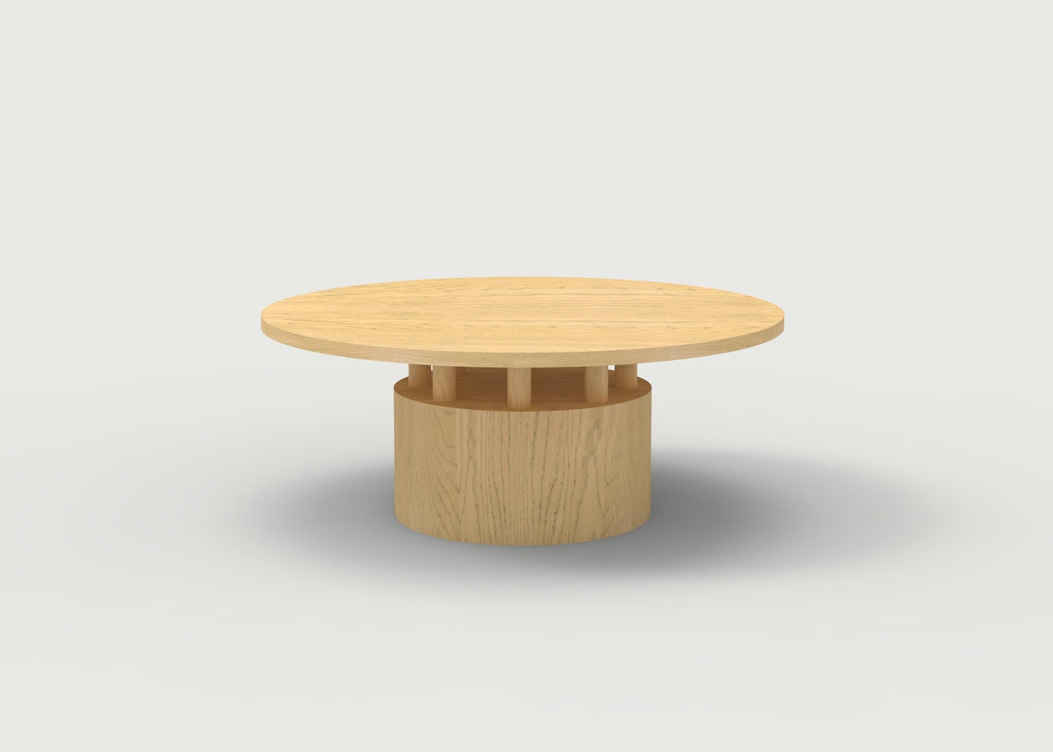 American Wood Coffee Table with Round Base and Painted Cylindrical Posts Shown in Oak For Sale