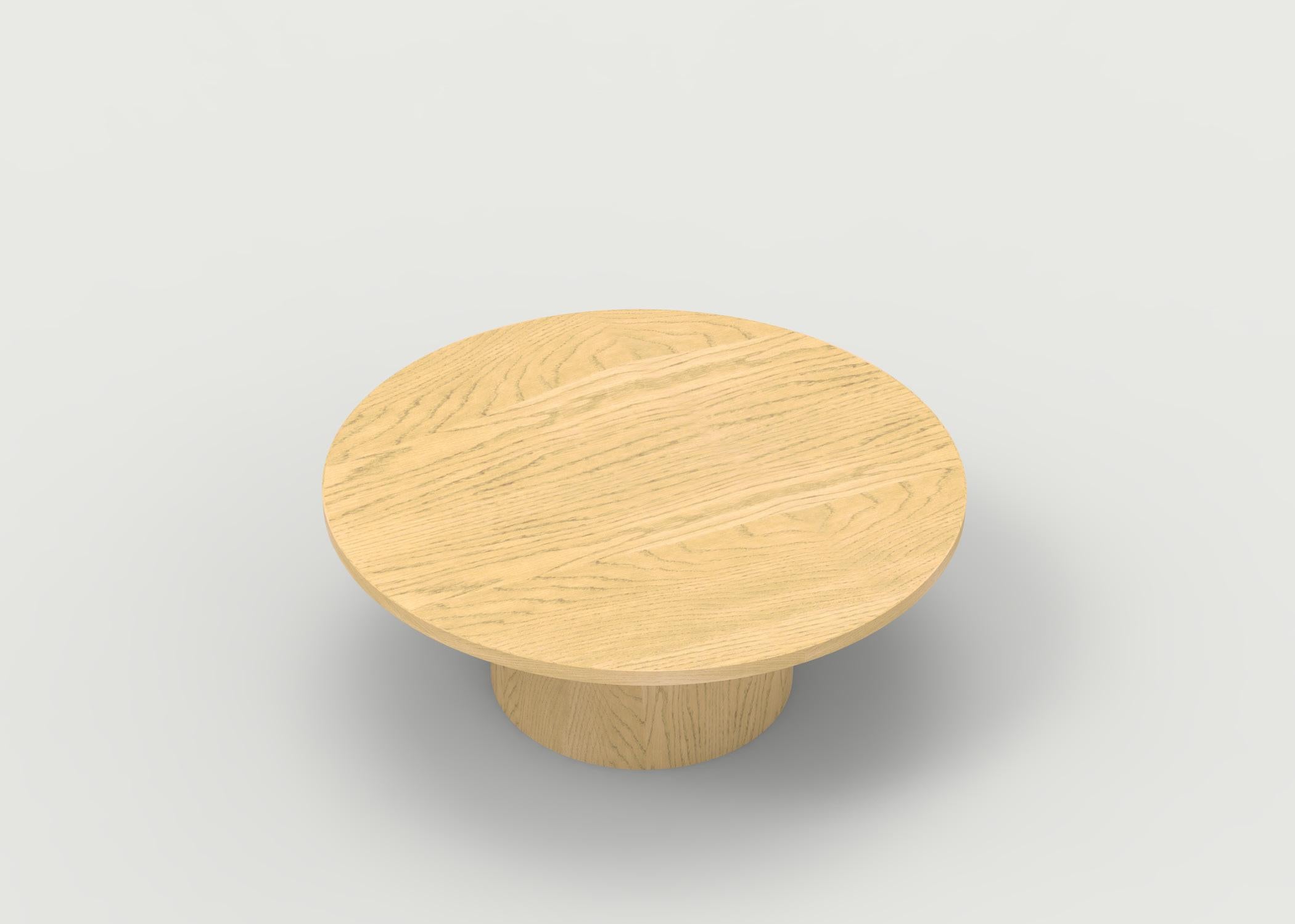 Hand-Carved Wood Coffee Table with Round Base and Painted Cylindrical Posts Shown in Oak For Sale