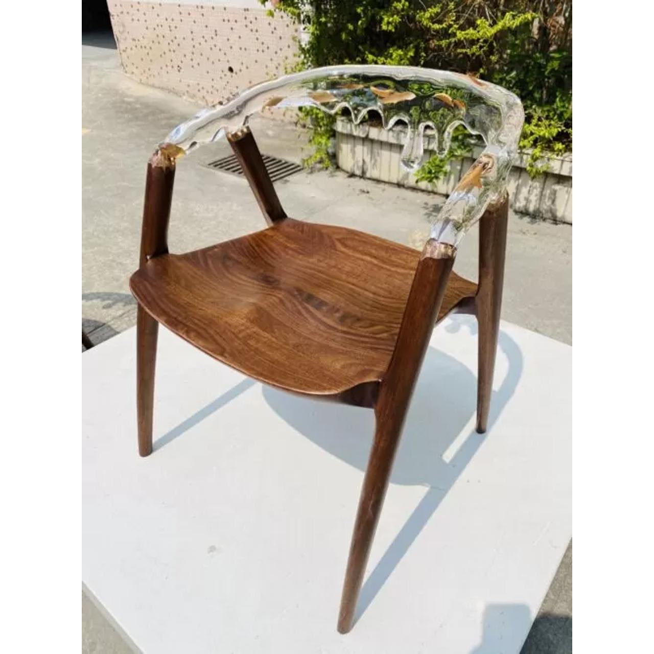 This Branched Crystal Armchair is the epitome of modern luxury, blending crystal mixed acrylic with authentic wooden branches to create a stunning work of art. Its smooth, lustrous design reflects elegance and sophistication, making it the perfect