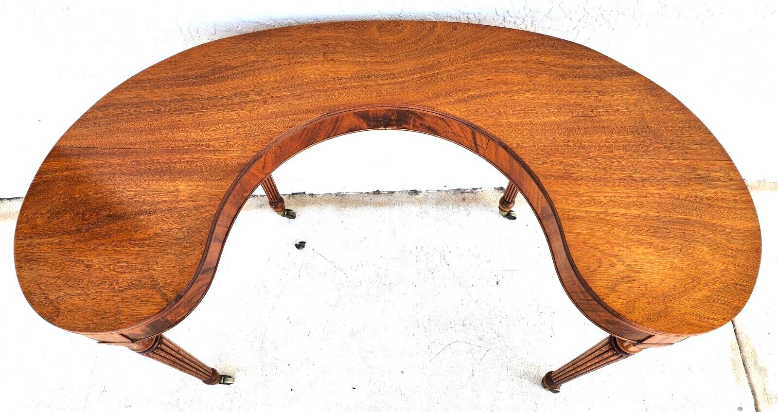 For FULL item description click on CONTINUE READING at the bottom of this page.

Offering One Of Our Recent Palm Beach Estate Fine Furniture Acquisitions Of A 
Mid-Century Kidney Horseshoe Shaped Wood Console Table or Writing Desk 

Approximate