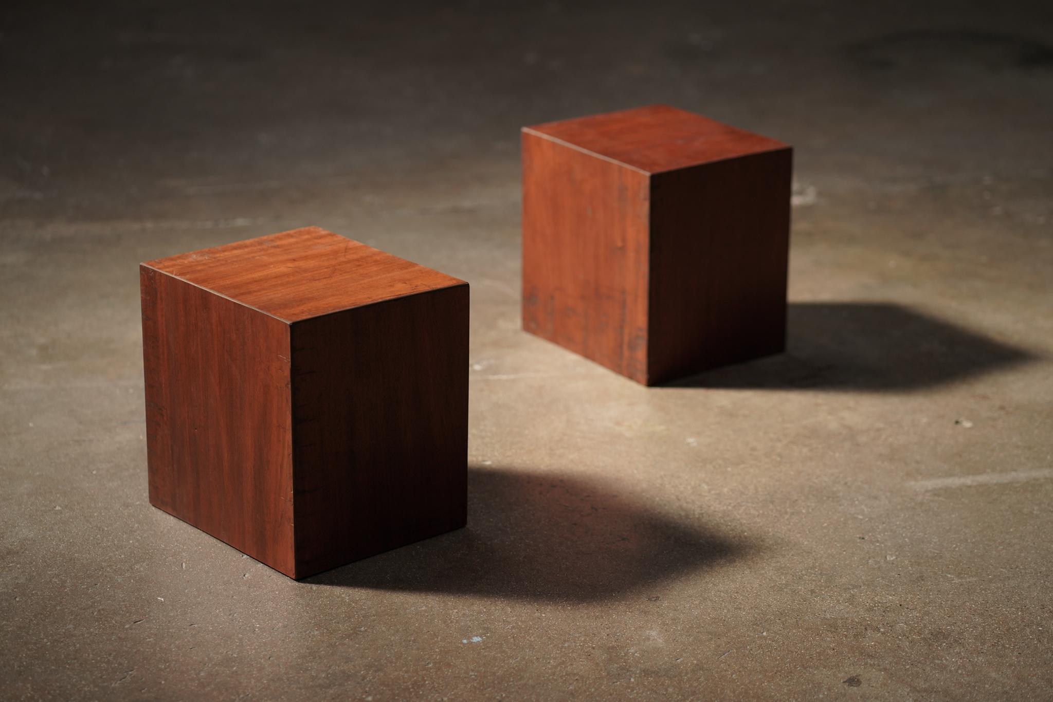 These mid-20th-century Belgian Square wood block side tables showcase a rich patina that highlights the natural character of the warm wood. 
These can be great used as a single side table or as a pair — two are available.