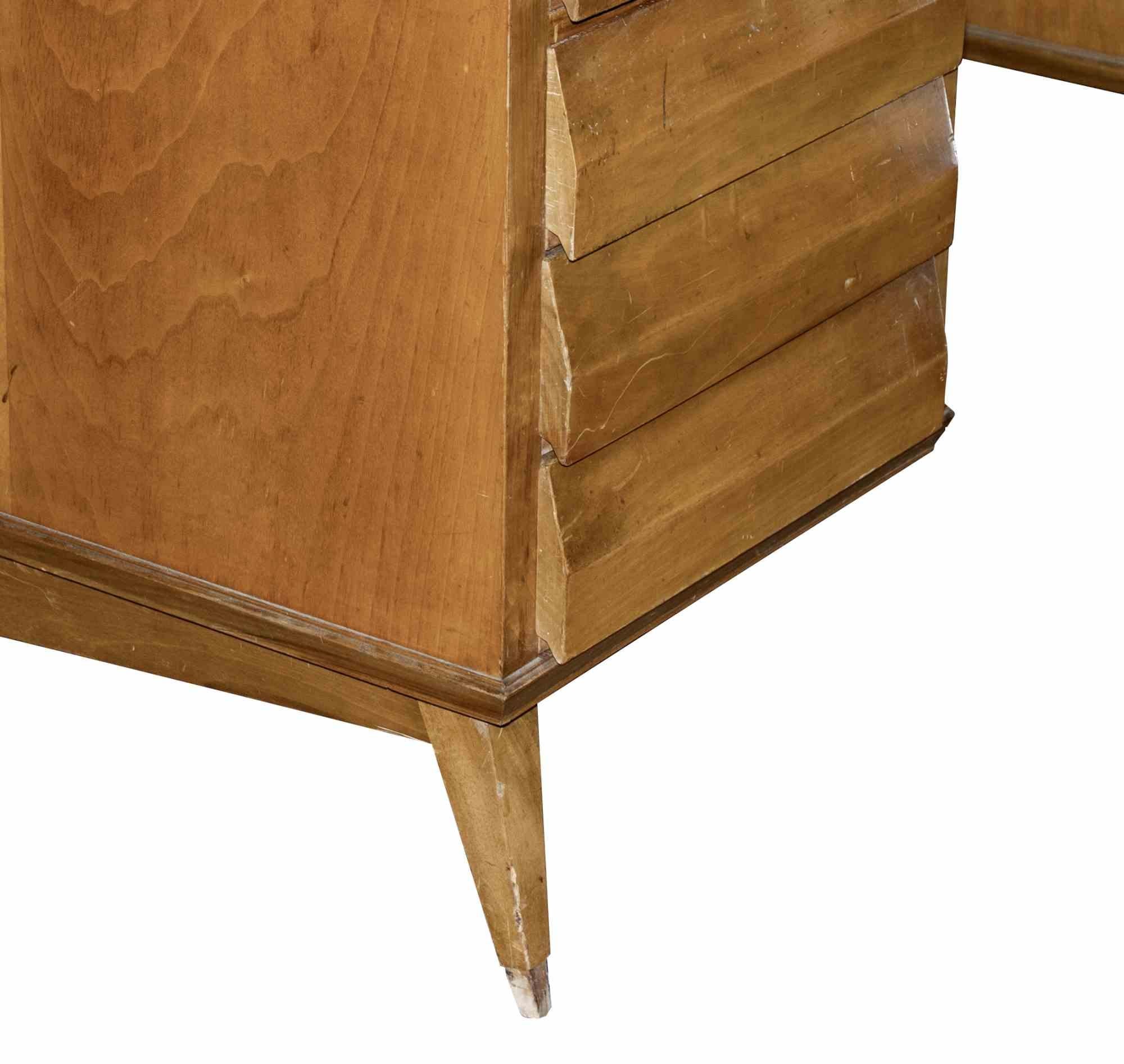 Mid-century wood desk is an original design furniure item realized in the mid-20th century and attributed to Melchiorre Bega.

Extraordinary monumental wooden desk with side drawers.

Mint conditions (scratched wood and lack of little