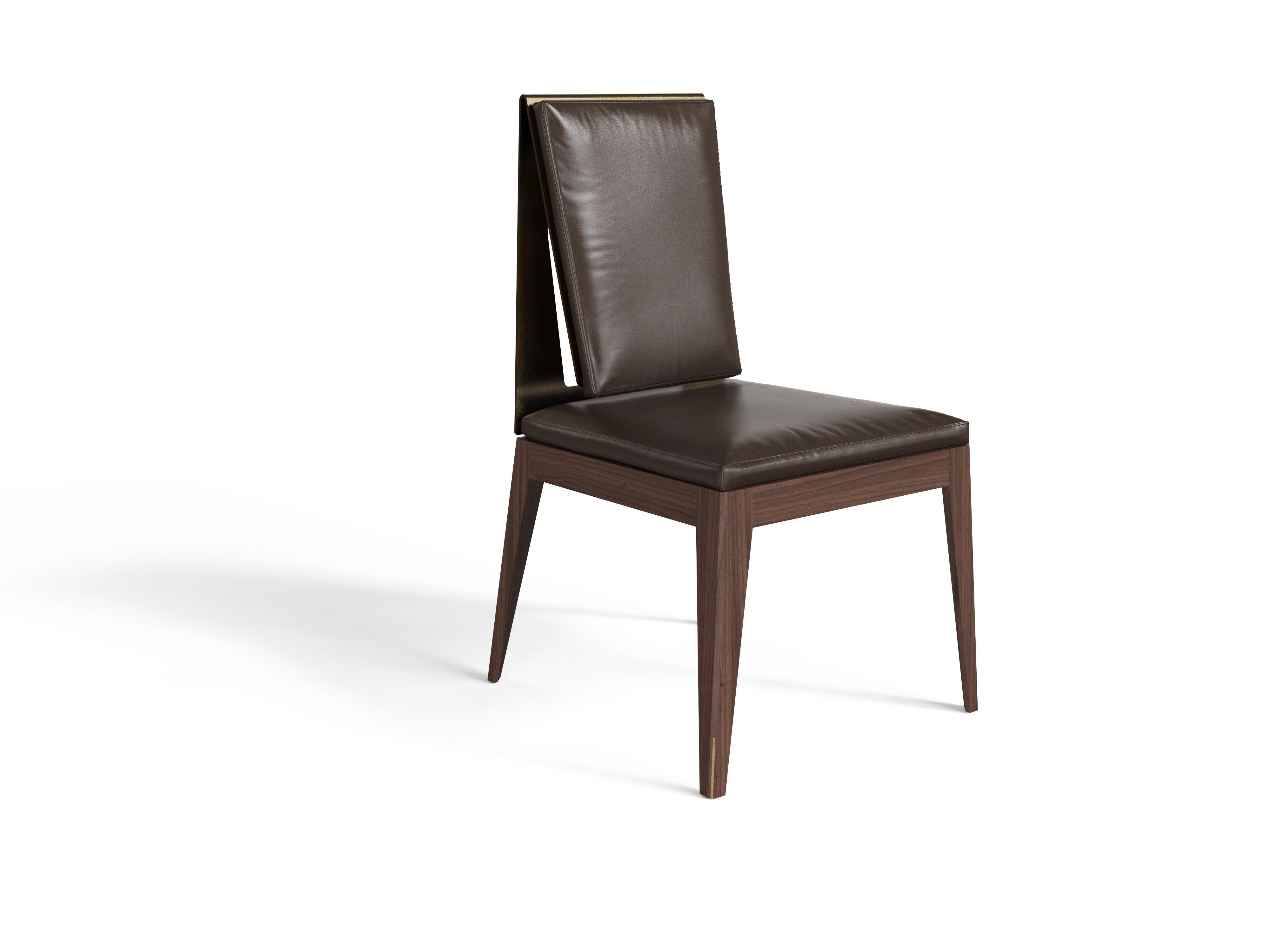 Wooden Dining chair, walnut or oak structure with leather upholstery.

The 