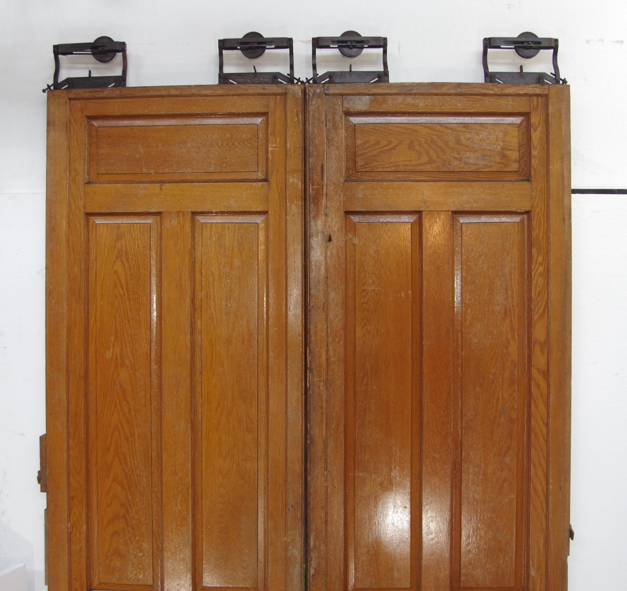 Antique six panel pocket door set with medium tone wood complete with original wheels. Track not included. Priced as a double. This can be seen at our 400 Gilligan St location in Scranton, PA. Measures: 109.5