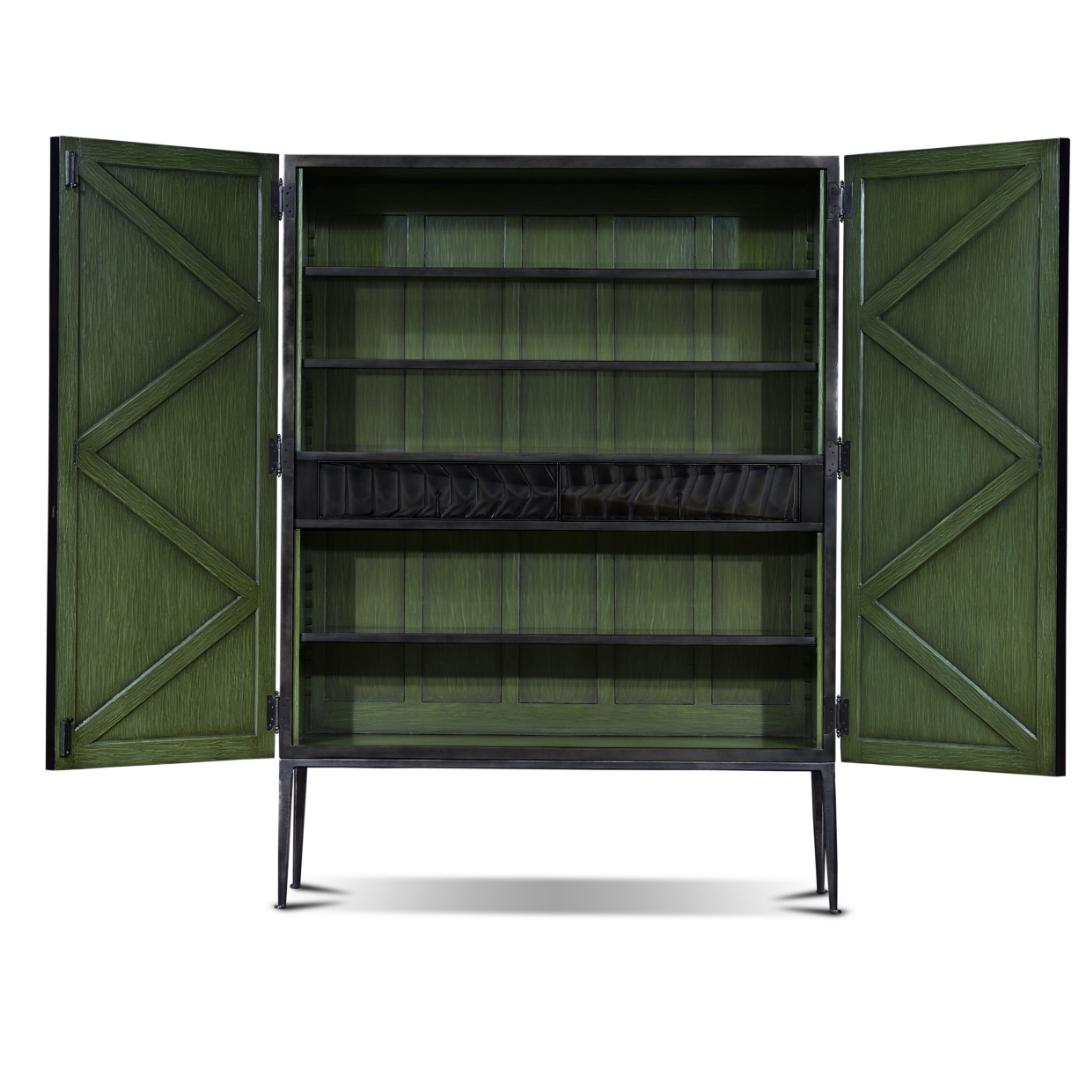 This stunning armoire shows an asymmetrical textured design on its doors that resembles movement. It has a simple metal base and contrasting interiors adapted to be used as a bar. The finish is made to look like polished metal but is made entirely