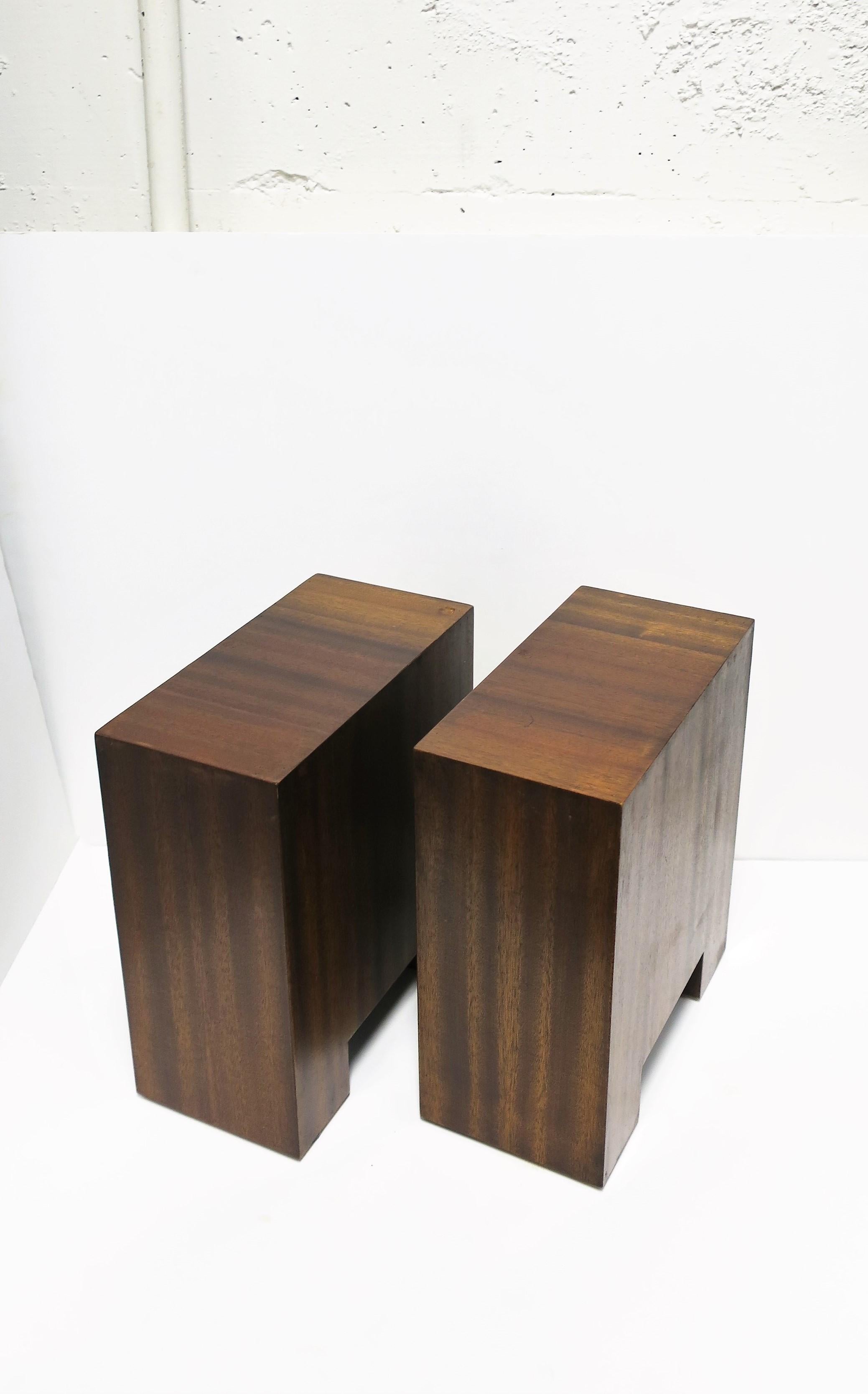 A pair of Minimalist brown wood end or side/drinks tables, circa late 20th to early 21st century. Tables are rectangular and a convenient size. Dimensions: 6