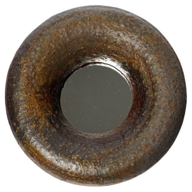 Wood fired ceramic mirror by Mia Jensen, 2025.