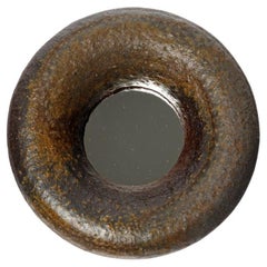Wood fired ceramic mirror by Mia Jensen, 2025.