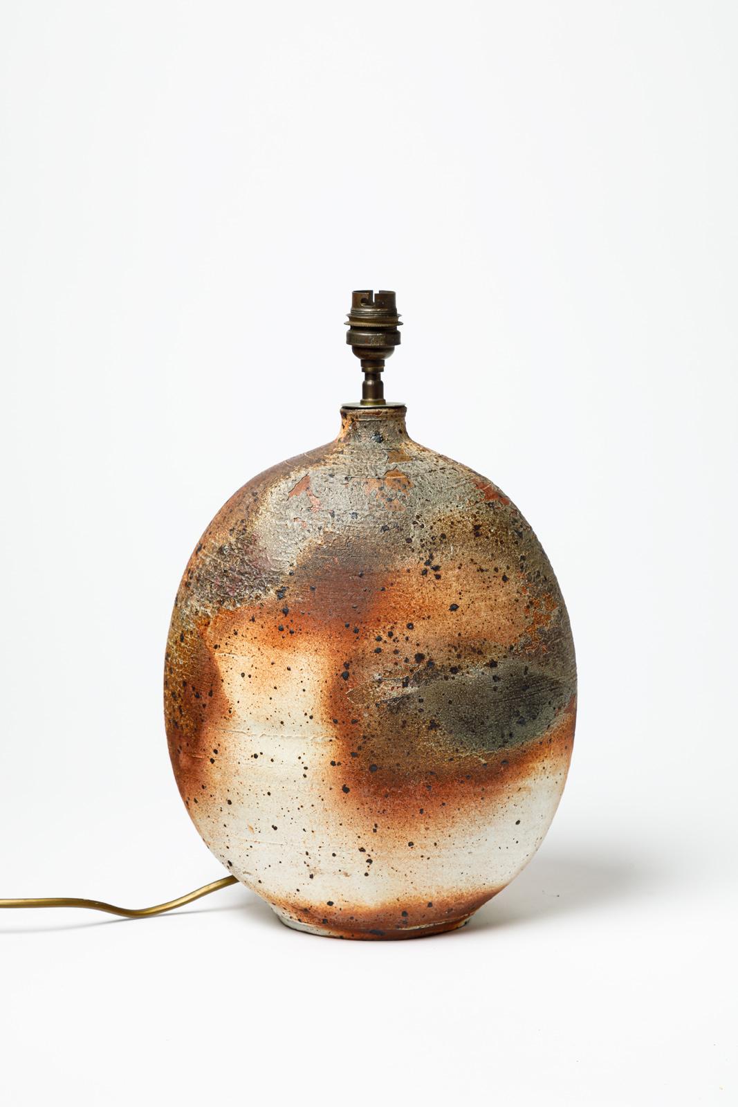 Wood fired stoneware table lamp by Bruno H’rdy.
Artist signature under the base. Circa 1960-1970.
H : 11.8’ x 8.7’ x 4.7’ inches (ceramic only).
Sold with a European electrical system.