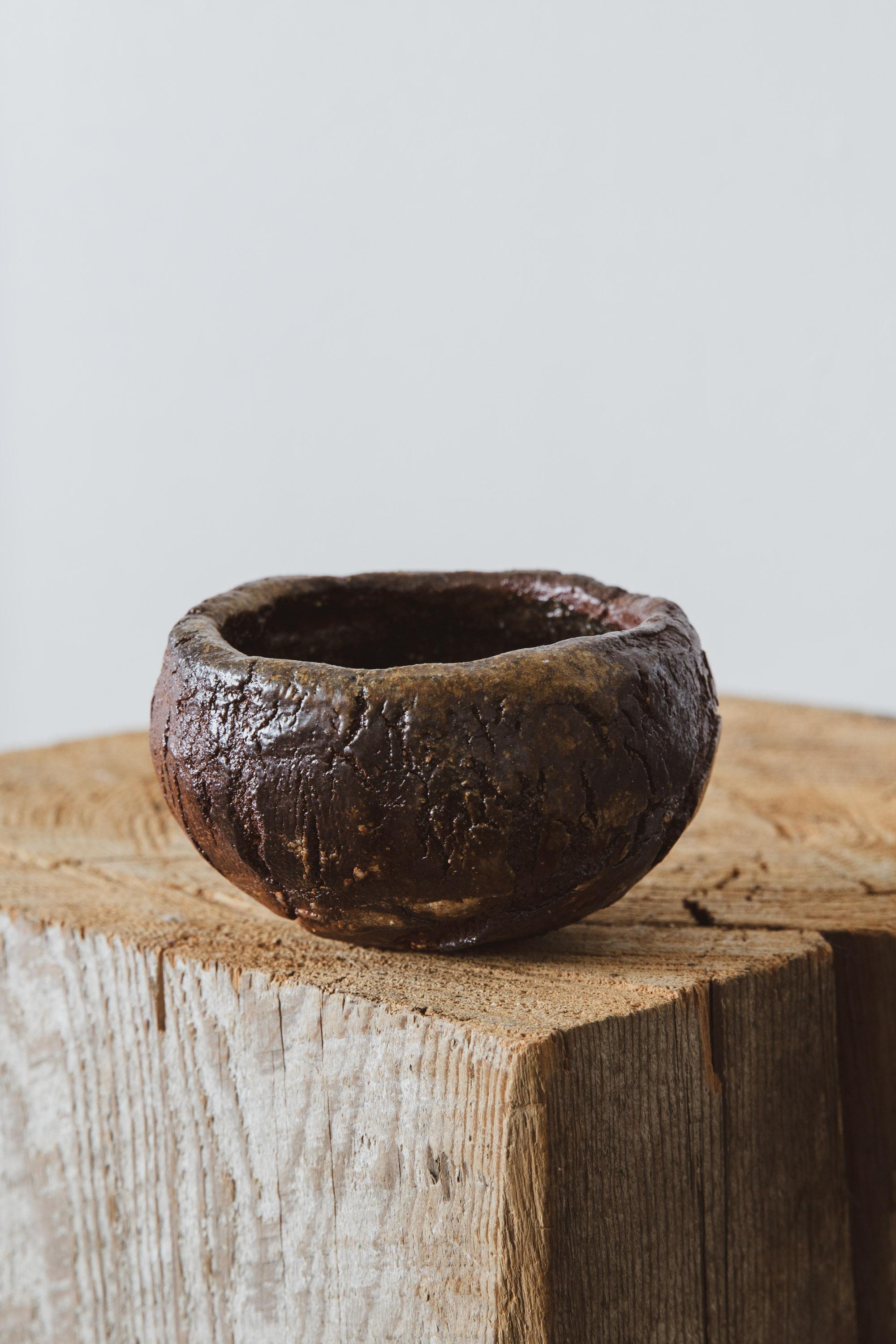 Introducing the Wood Fired Votive 4 with its delicate cracked surface texture and variegated color, a testament to the mesmerizing artistry of wood firing. This unique ceramic votive embodies the perfect marriage of nature and craftsmanship,