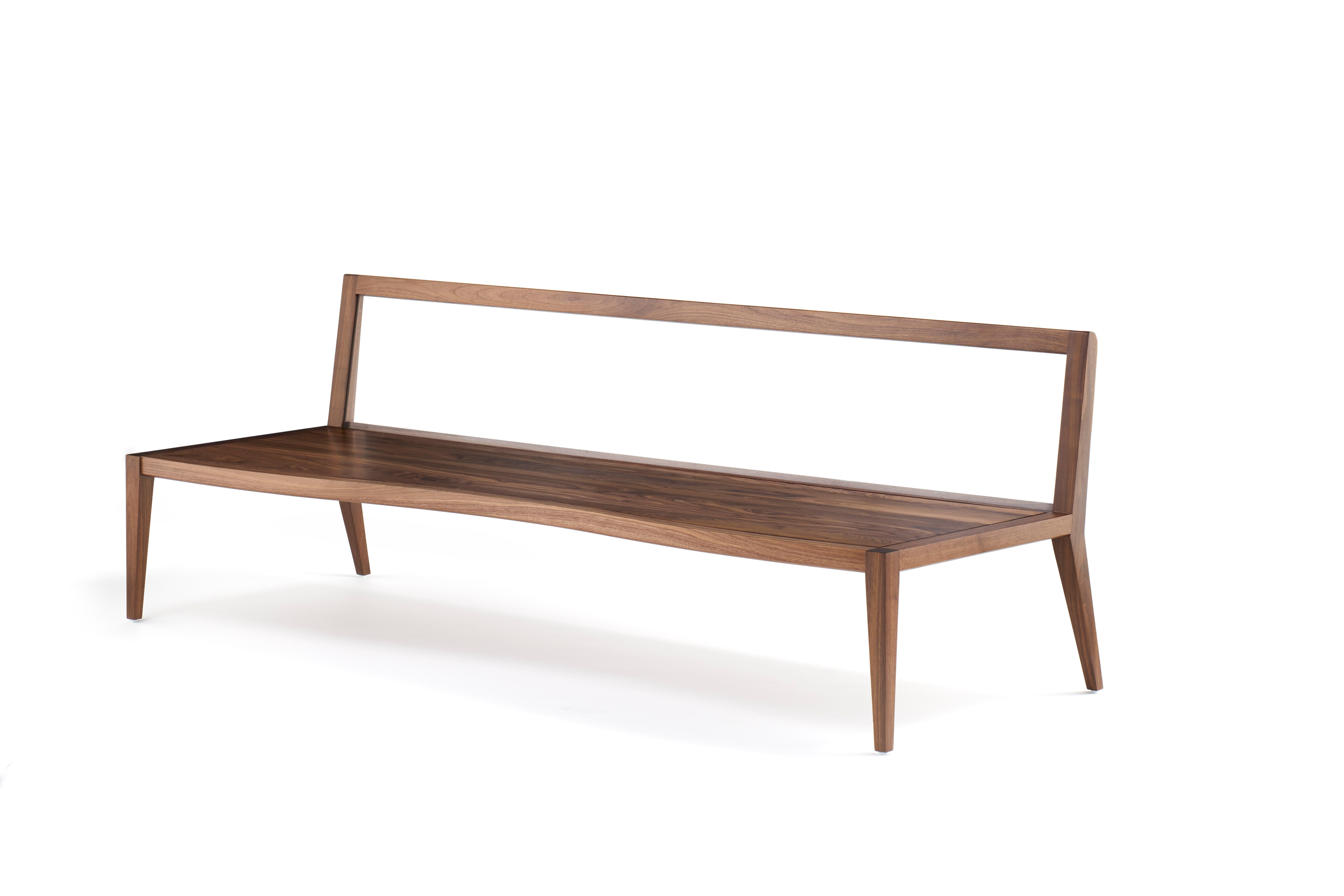 No. BCH-003

The Wood Float Bench blurs the lines between art and furniture. Handcrafted from solid walnut, the seat is elegantly curved in contrast with the structured back, which is supported by transparent acrylic and acts as an interactive