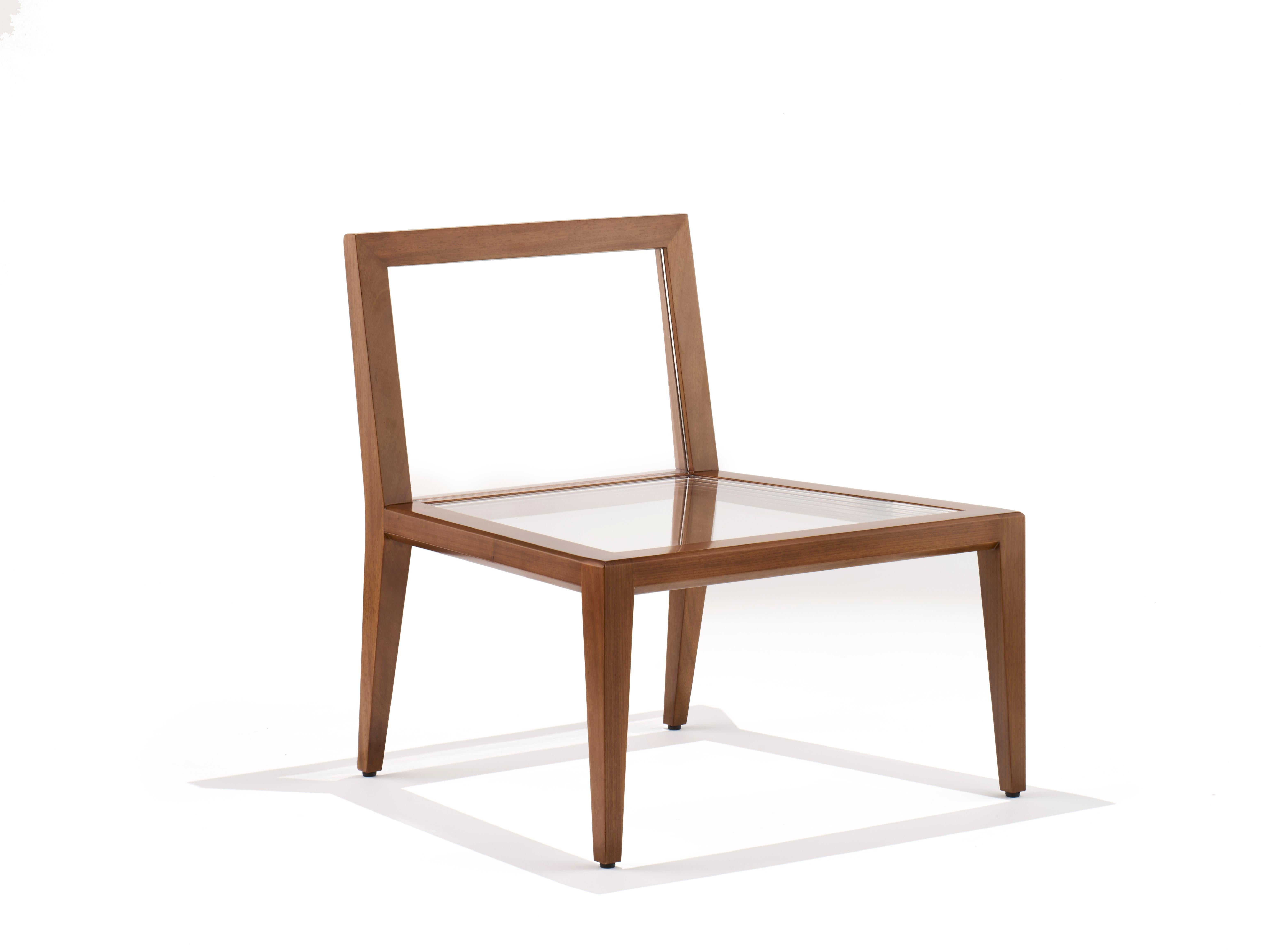 The wood float chair blurs the lines between art and furniture and encourages an internal dialogue with the viewer. Is this art or can I sit on it? Both. Handcrafted from solid walnut, the frame is elegantly structured and supported by a transparent