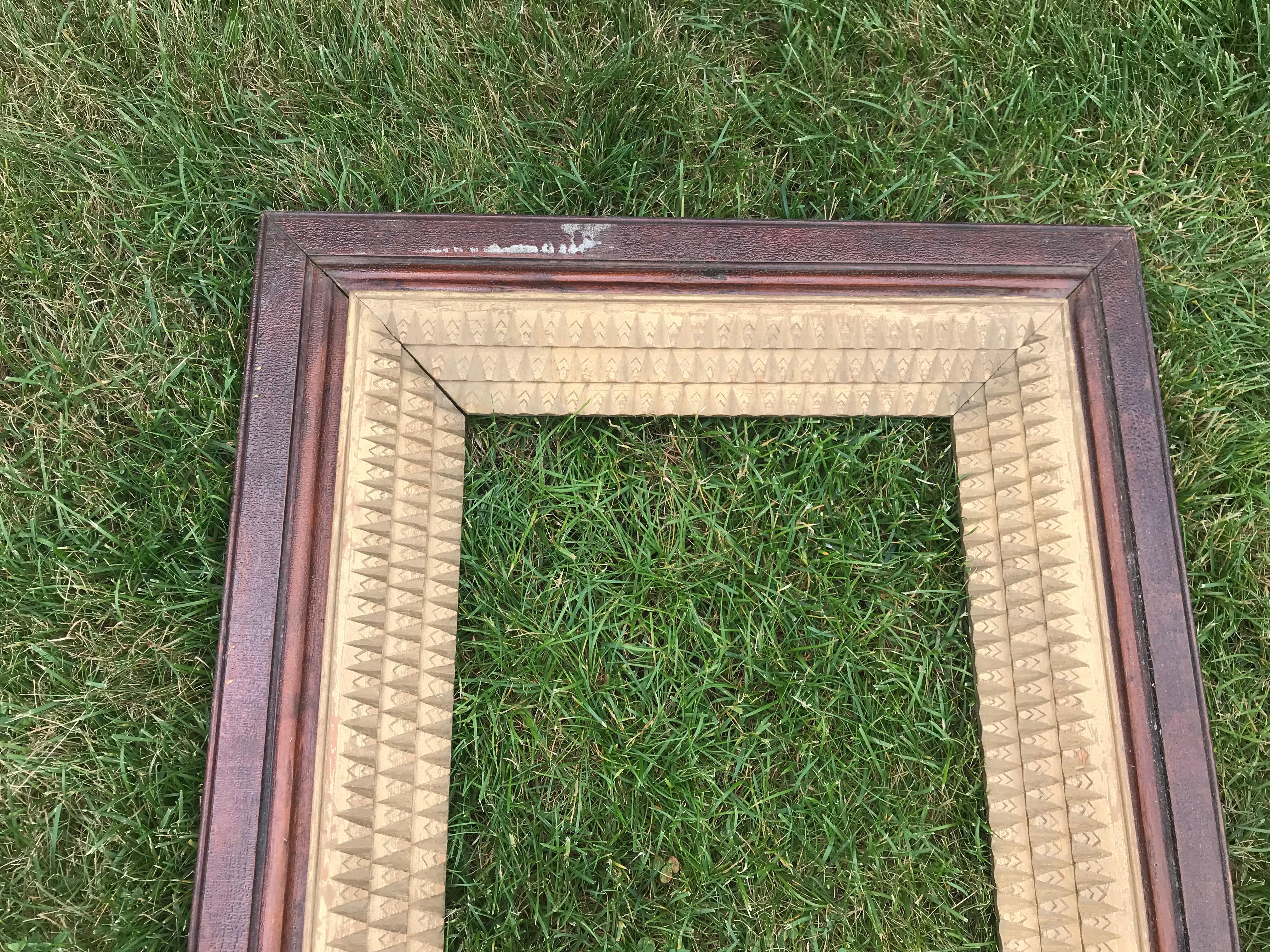 Wood frame with layered gilt.