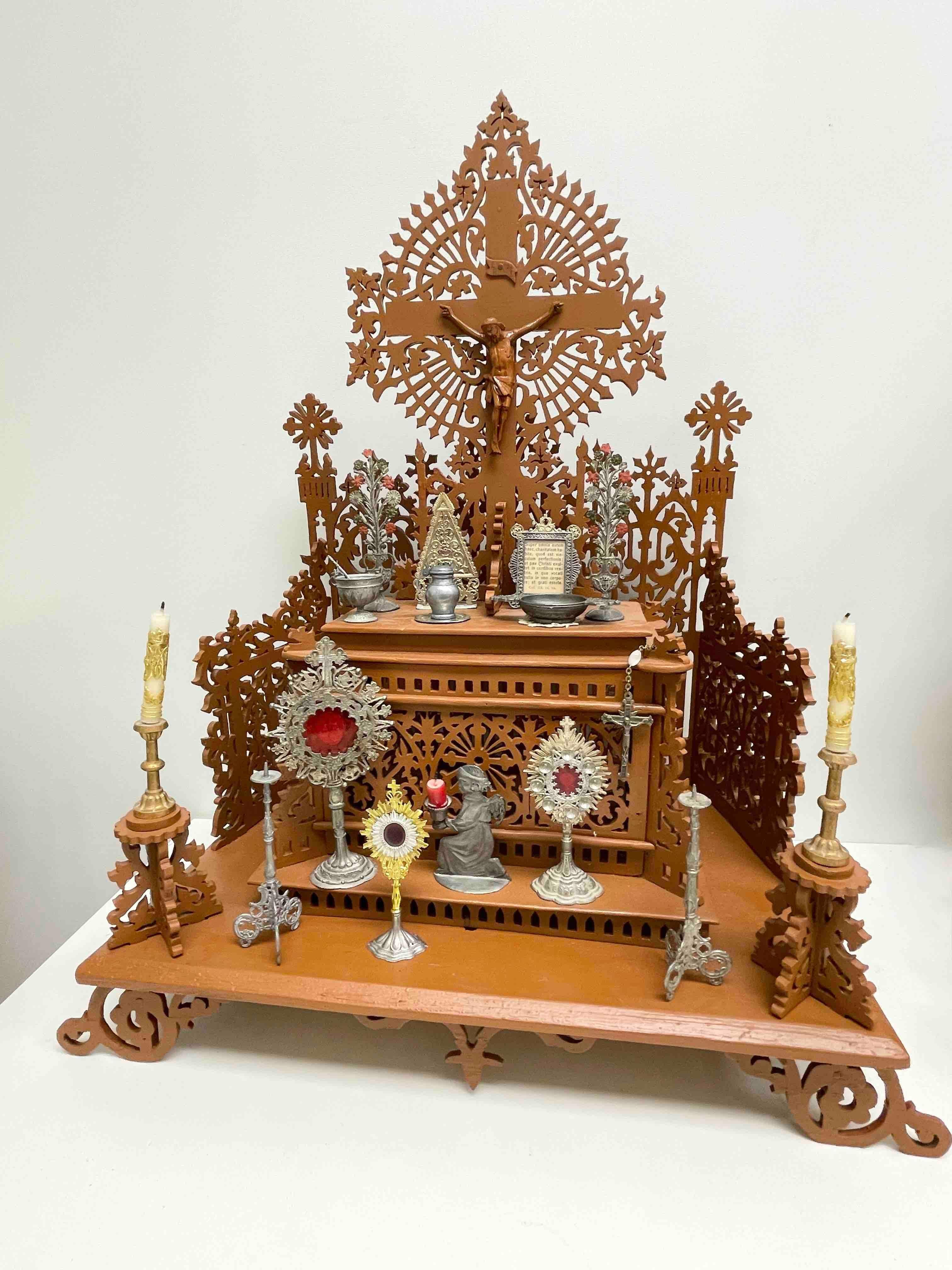 Here I have to offer a fine antique classic early 20th century fretwork hand crafted House Altar with a lot of Christianity miniatures and accessories. A wonderful decorative appeal! 
This is a truly a fine older piece. Great Item in your home. As