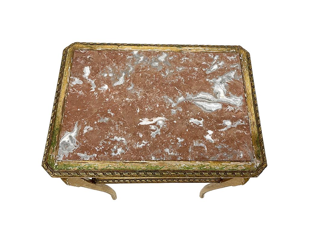 Wood gilded rectangular side table with marble top

French rectangular wood gilded table with marble top raised on 4 legs with Acanthus leaf pattern and a rattan woven interleaf in between 
The measurement is 76 cm high and 54.5 cm wide and the