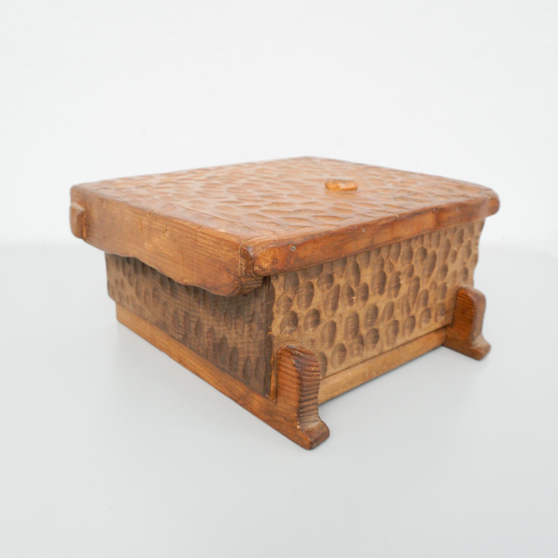 Wood handcarved box after Alexandre Noll
Signed Tony to the underside.
Late 20th century.

In original condition, with minor wear consistent of age and use, preserving a beautiful patina.

The box has a manual lock to prevent it from being