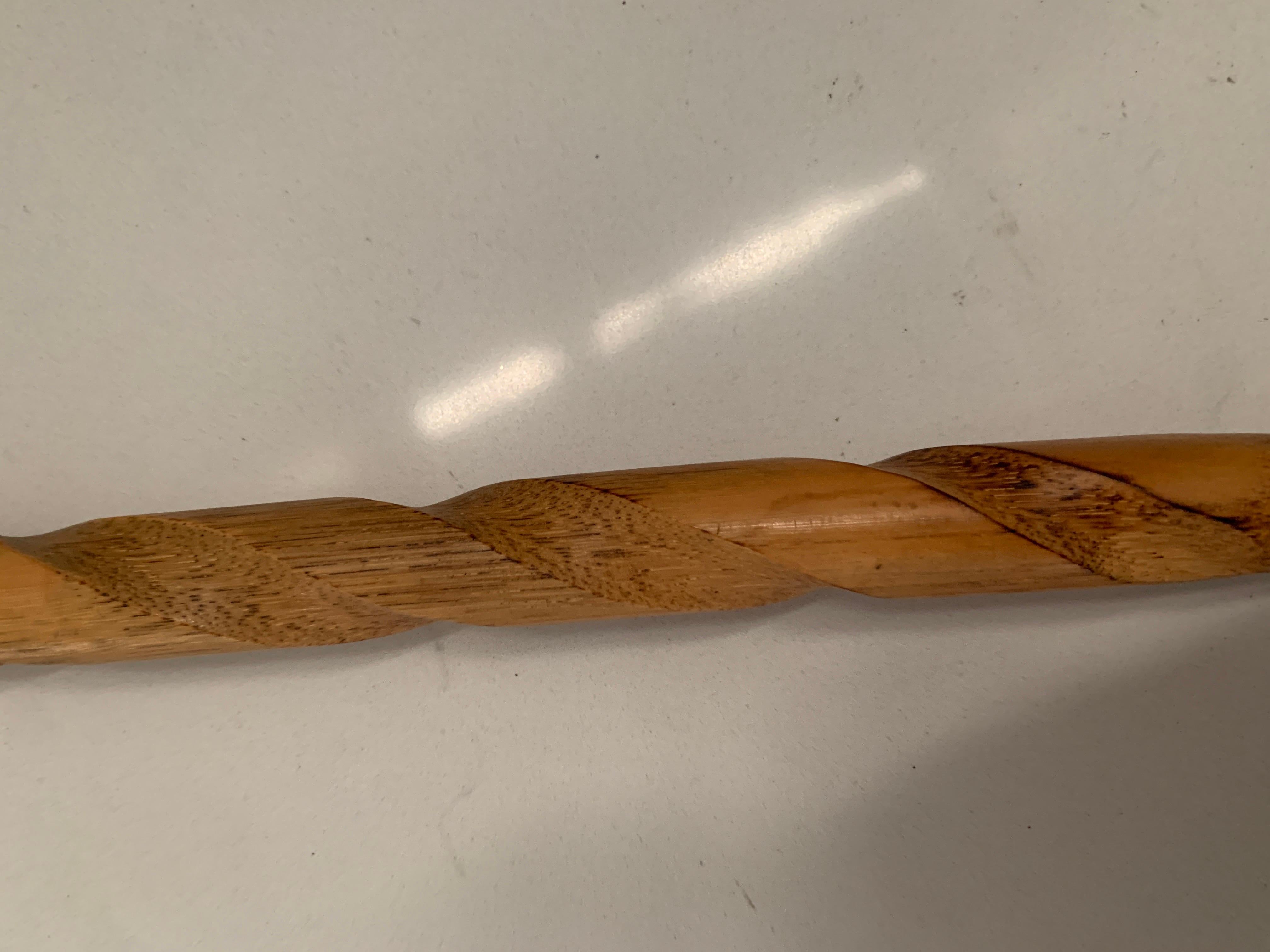 A delightful shoe horn with a dog head depiction atop. The piece is wood with an acrylic Tortoise look horn and dog handle. The piece is quite long and has a small eye loop for hanging. A nice addition to the dressing or mud room.