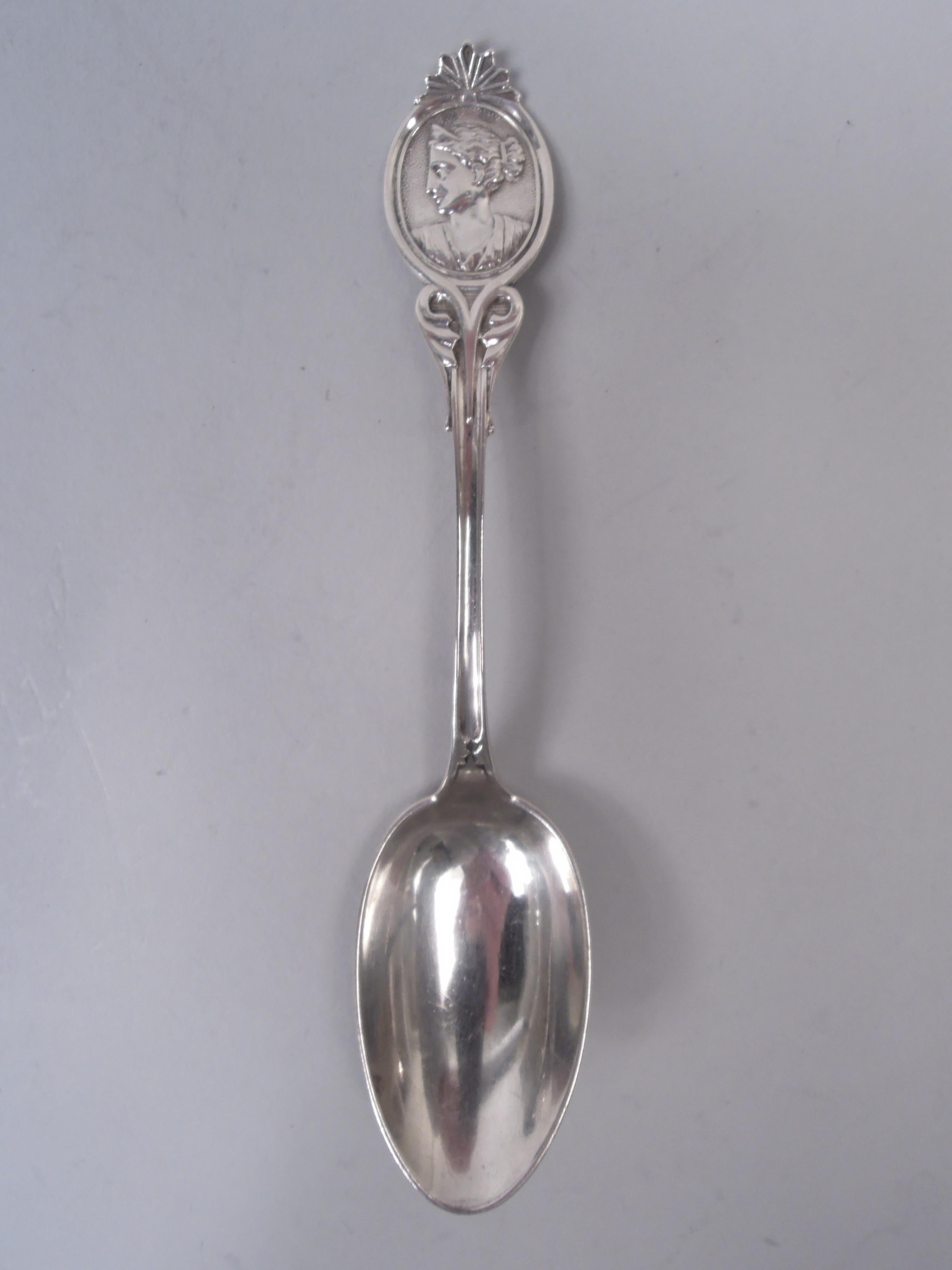 Set of 6 Medallion coin silver teaspoons, ca 1860. Each: Left-facing Diana in oval terminal mounted with scallop shell; leafing volute scroll stem. Interlaced script monogram engraved on terminal verso. Marked with New York maker’s (Wood & Hughes)