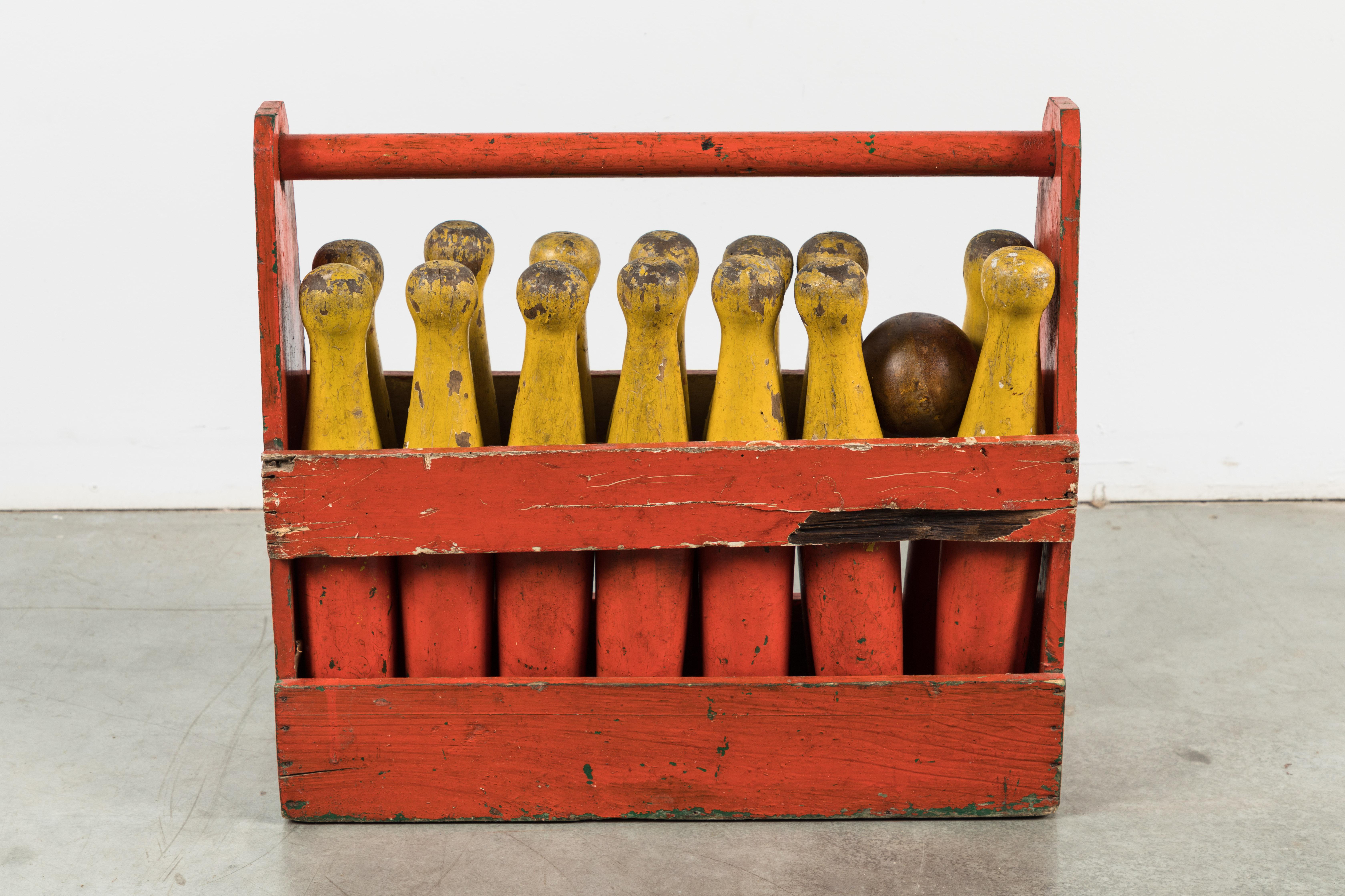 Lawn bowling set and caddy. The best orange and yellow paint. Great as a display or design accessory. Or play the game! Complete and as good as it gets. Includes 14 wood carved pins with original paint surface, two original natural surface game