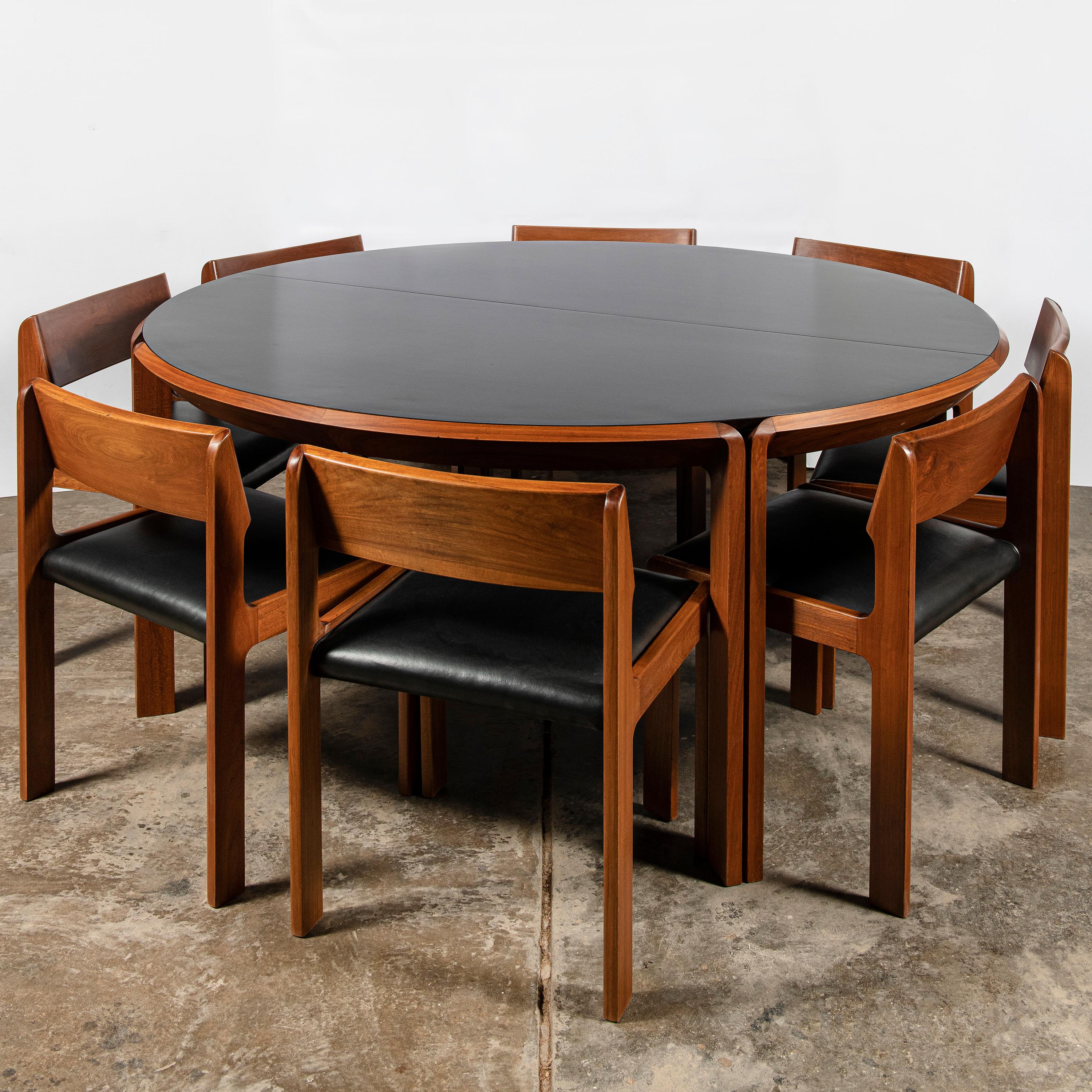 Wood, leather and formica dining room set for 10 people by Churba. Argentina, Buenos Aires, 1970.
One wood and formica large table with extension and ten wood and leather chairs.

Table dimensions with extension: 72 cm height, 220 cm width, 170 cm