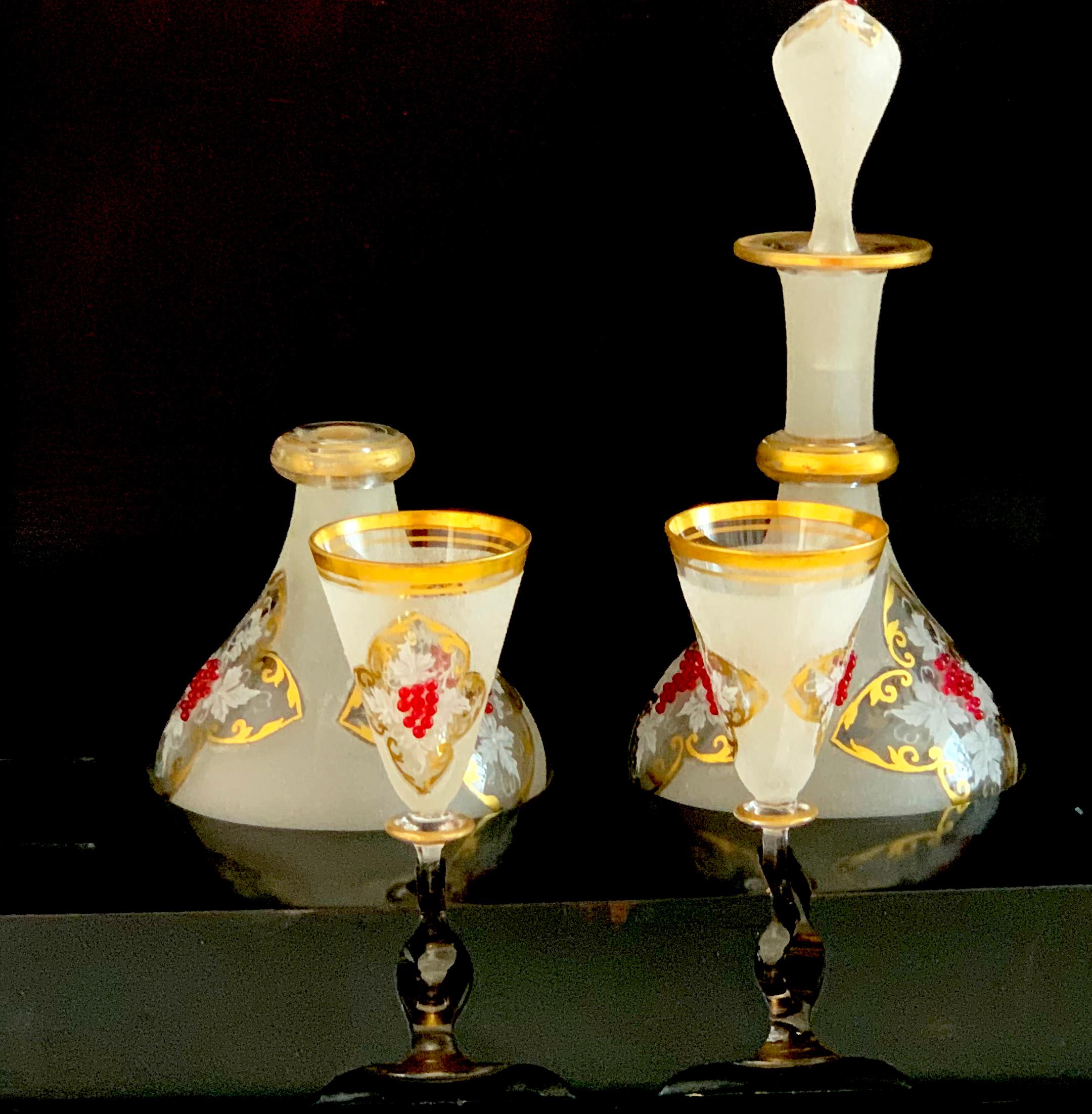 Beautiful dark wood box with two gold rimmed liquor glasses and two decanters with red pearls.
This lovely Travel Bar was made circa 1820 Biedermeier in Europe.
The box folds out on all sides to display the set. The box does not close.