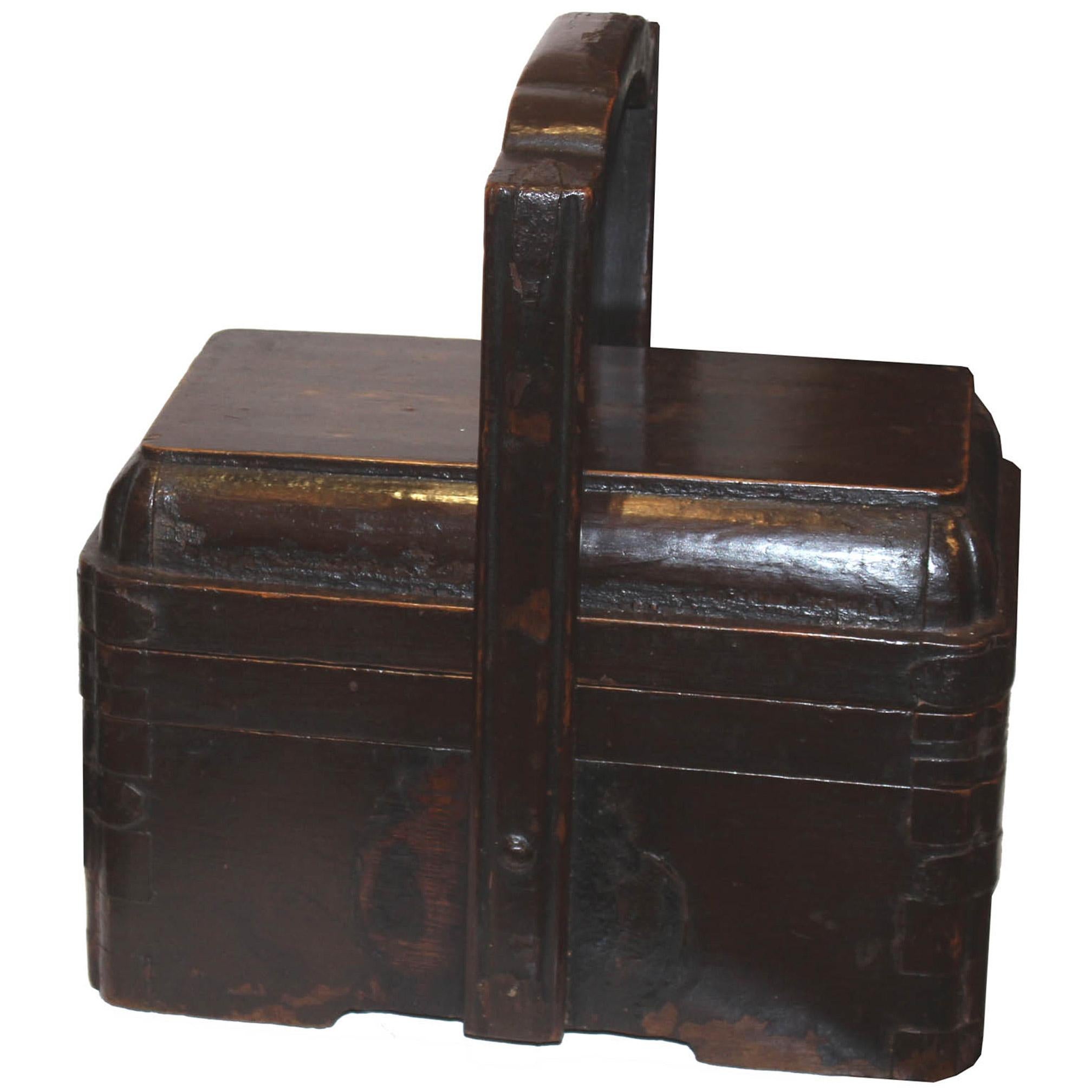 Wood lunch box with handle used to carry food to a temple or ceremonies. Open the lid and place rolled hand towels inside and display on a bathroom counter.
