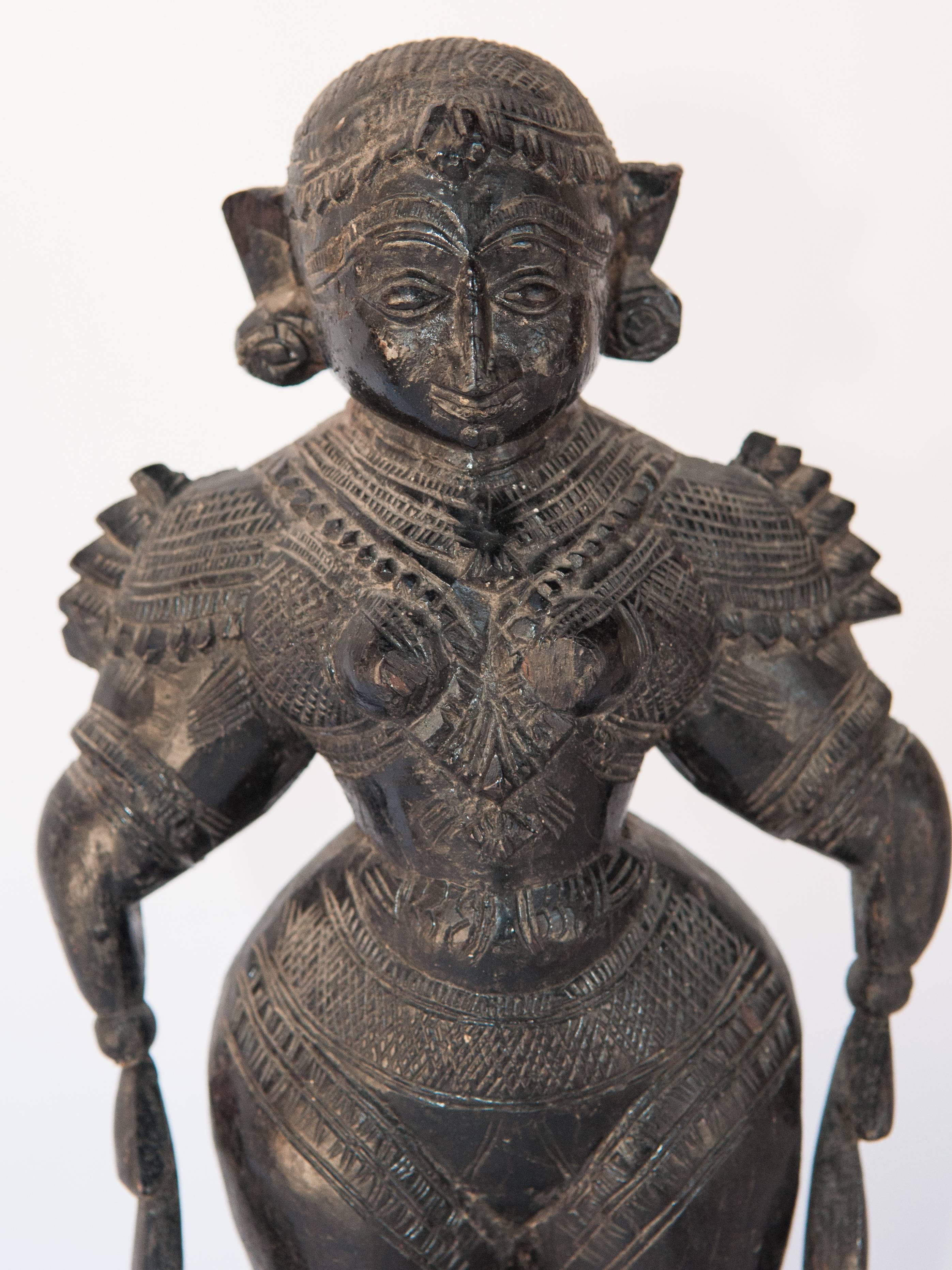 Wood Marapachi doll from Tamil Nadu, mid-20th century, hand-carved and blackened.
Offered by Bruce Hughes.
In the southern Indian state of Tamil Nadu parents present their daughter a pair of dolls, Marapachi Bommai, literally wooden dolls, on the