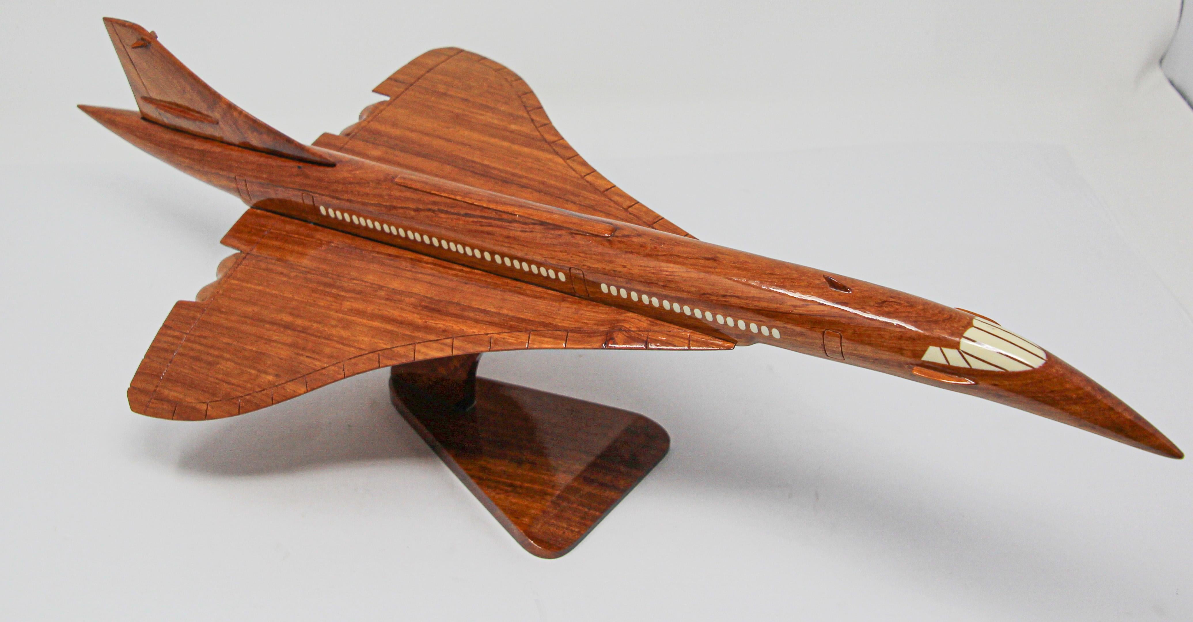 Model Concorde supersonic with light wooden body, 
The Concorde, iconic in shape and ahead of its time.
This sleek elongated model of the supersonic Concorde aircraft exhibits a beautifully crafted fuselage in fruit wood.
Plane model of the