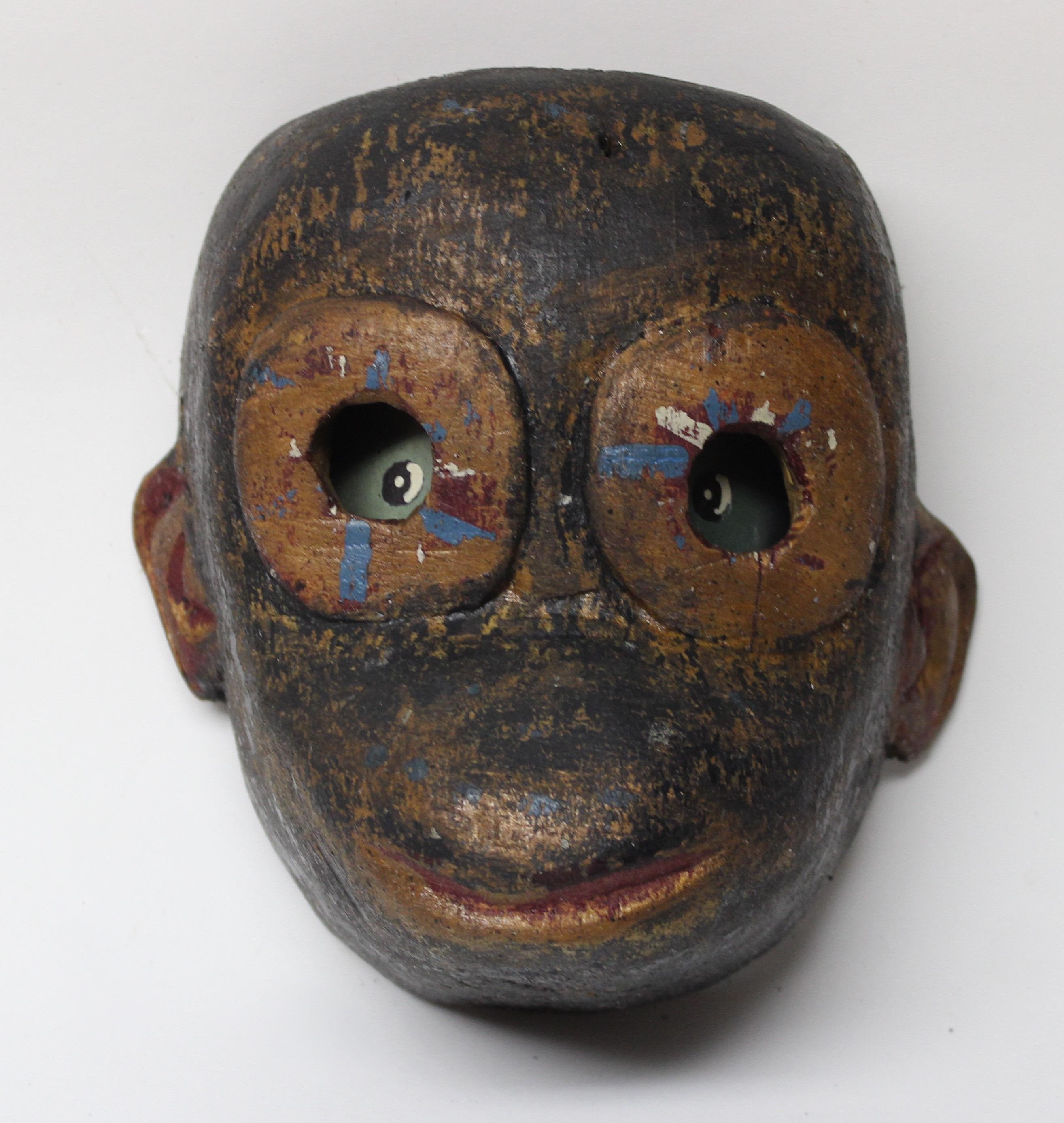 Carved wood tribal Folk Art monkey mask.