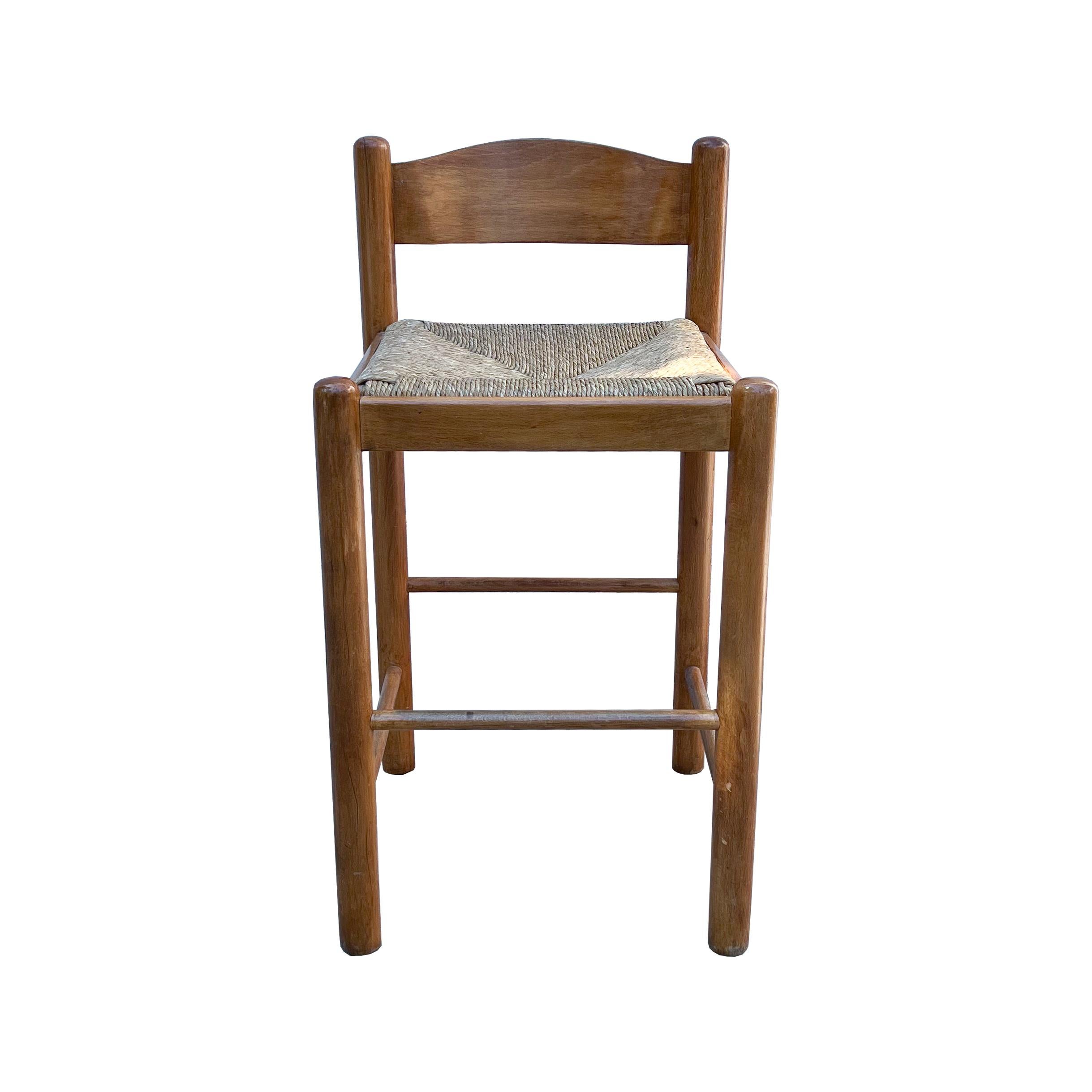 These warm wood Hank Loewenstein Padova style counter stools are simple yet elegant with rush seats. There are minor marks consistent with age, and the rush seating is in excellent condition. Strikingly comfortable and sturdy. There are three