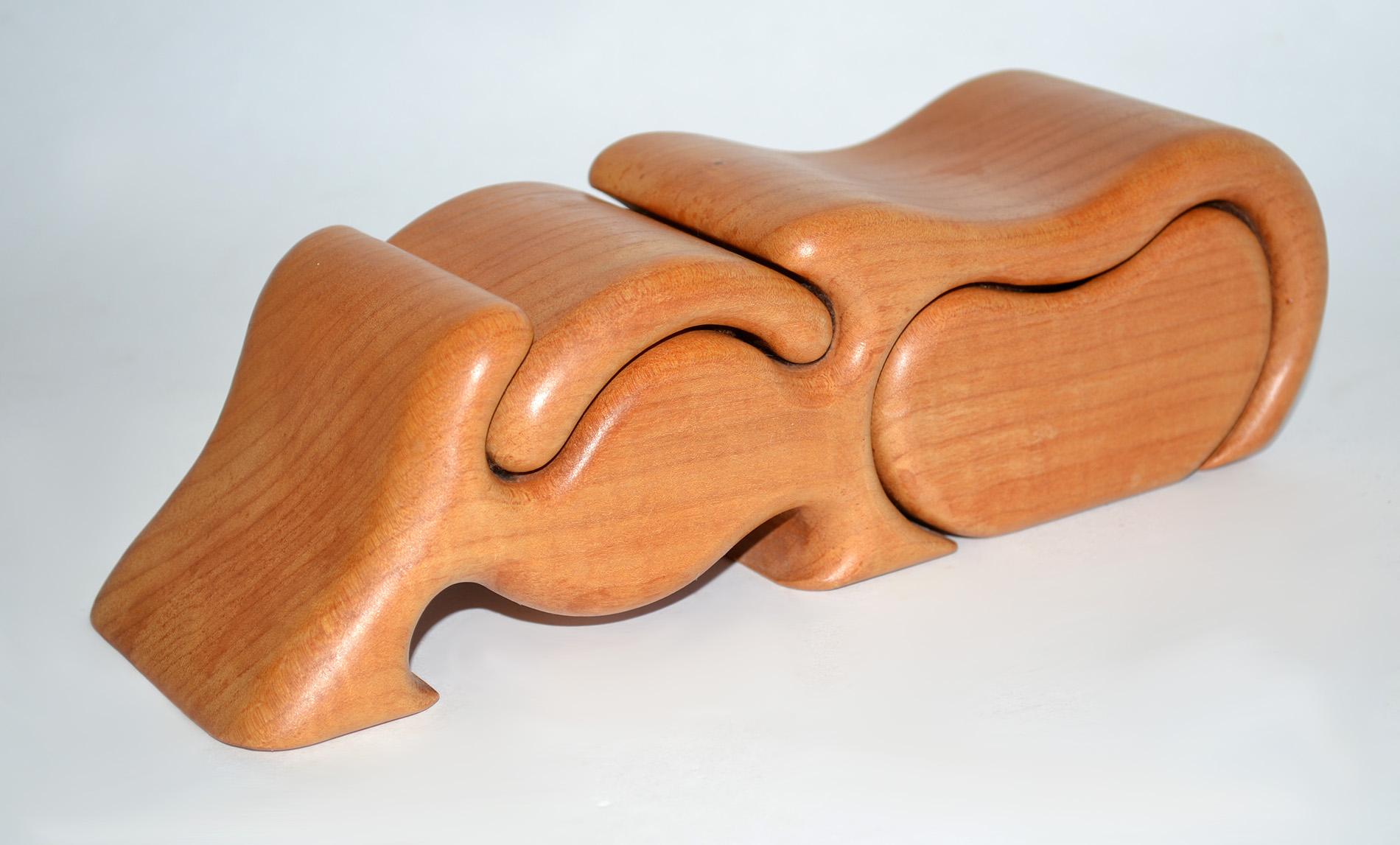 Wood Puzzle Jewelry Box 1970's
Hand carved dual-compartment wood jewelry or stash box. Flowing organic lines and joinery. One removable compartment, one removable lid. Felt lined. Stamped Maple to underside.  Contact us for a detailed condition