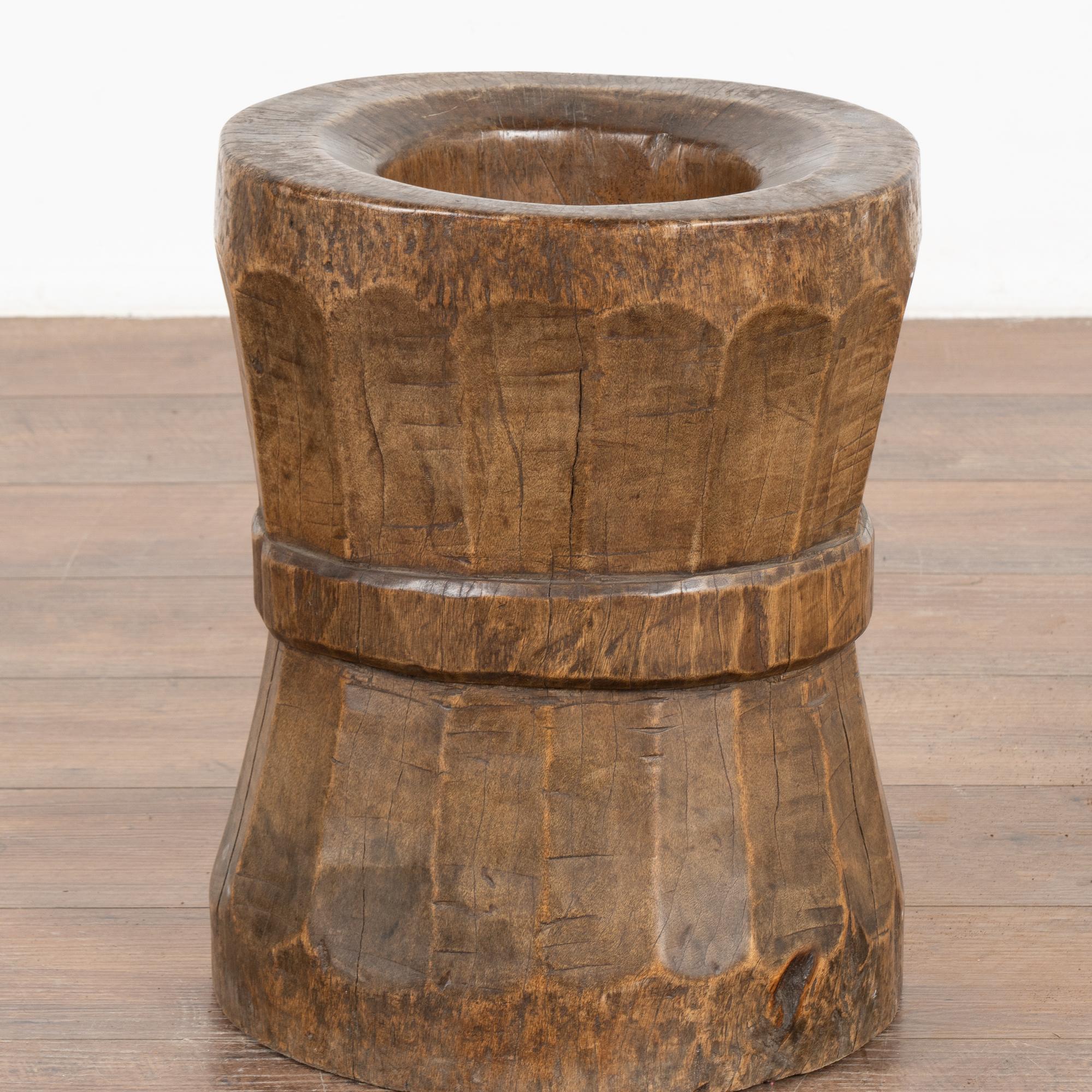 This wood accent piece originally served as a section of gear work from a water mill in China. The deep worn patina of the rich hard wood is warm and inviting. May be used as a container for display of dried arrangement or simply as a unique organic