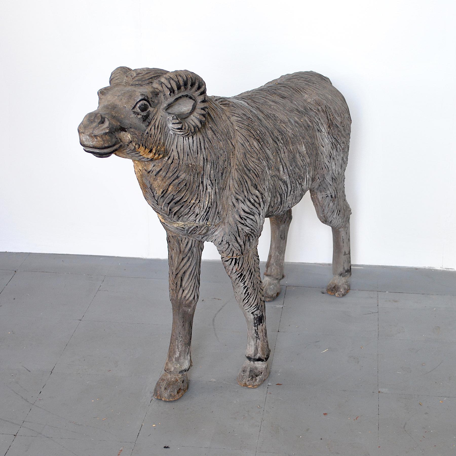 Finely refined natural size wood sculpture depicting a mutton.