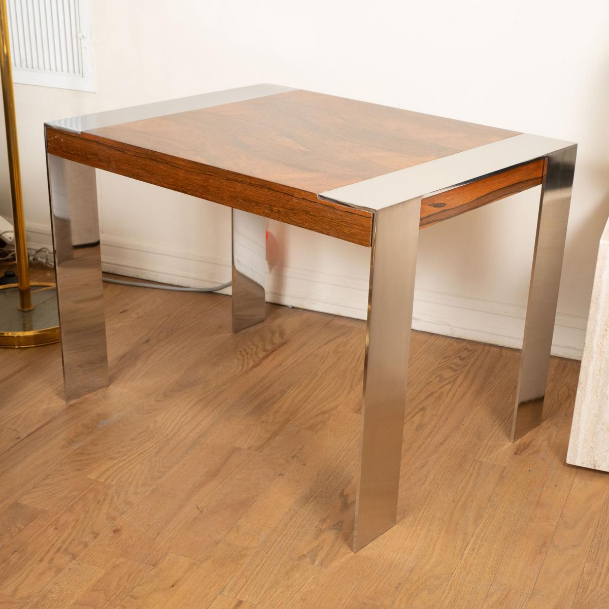 Wood side table with nickel details.