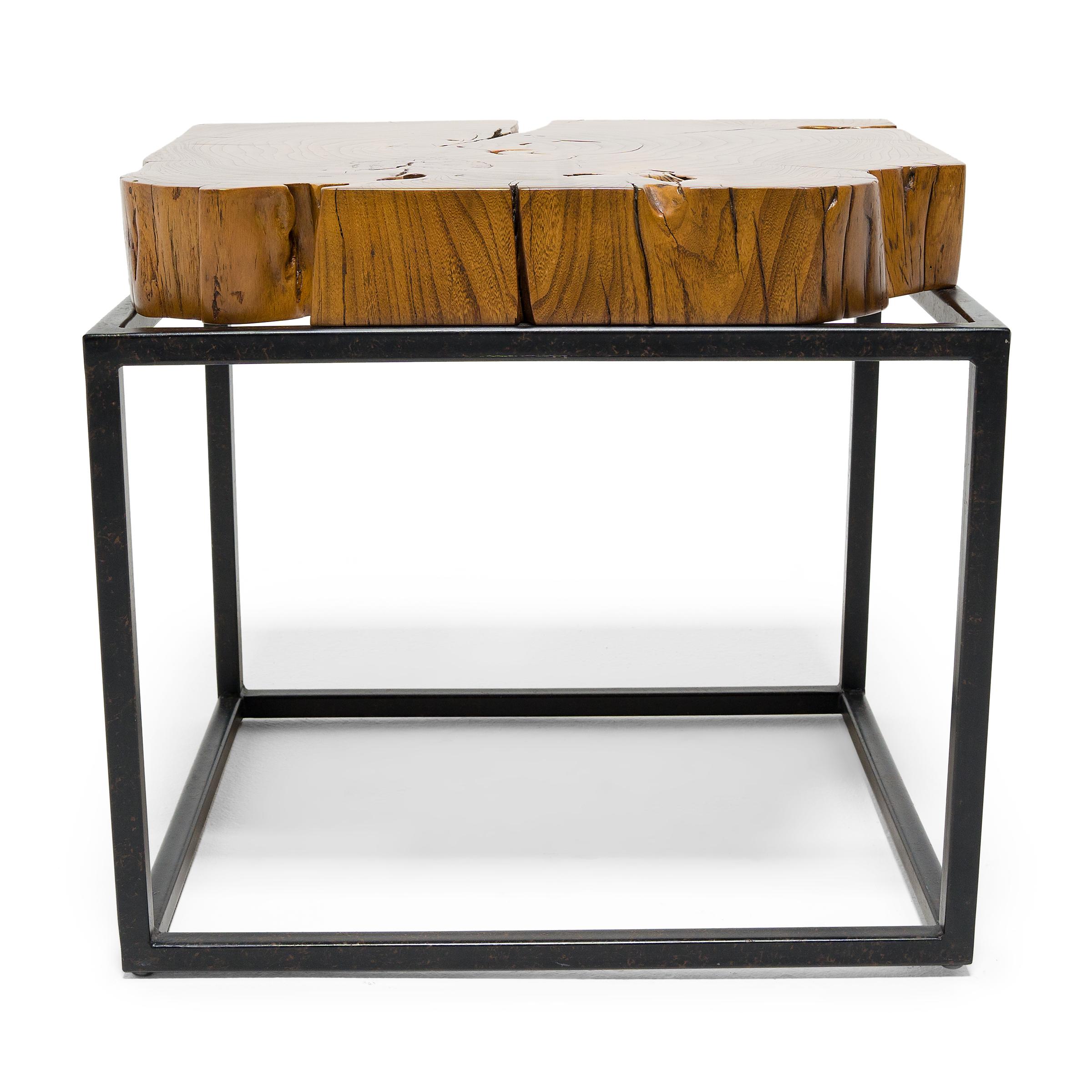 This contemporary side table from Guangzhou, China combines minimalist form with organic modern textures. The reclaimed tabletop is a gorgeous cross-section of Chinese northern elm (yumu), selected for its density, warm coloring, and beautiful grain