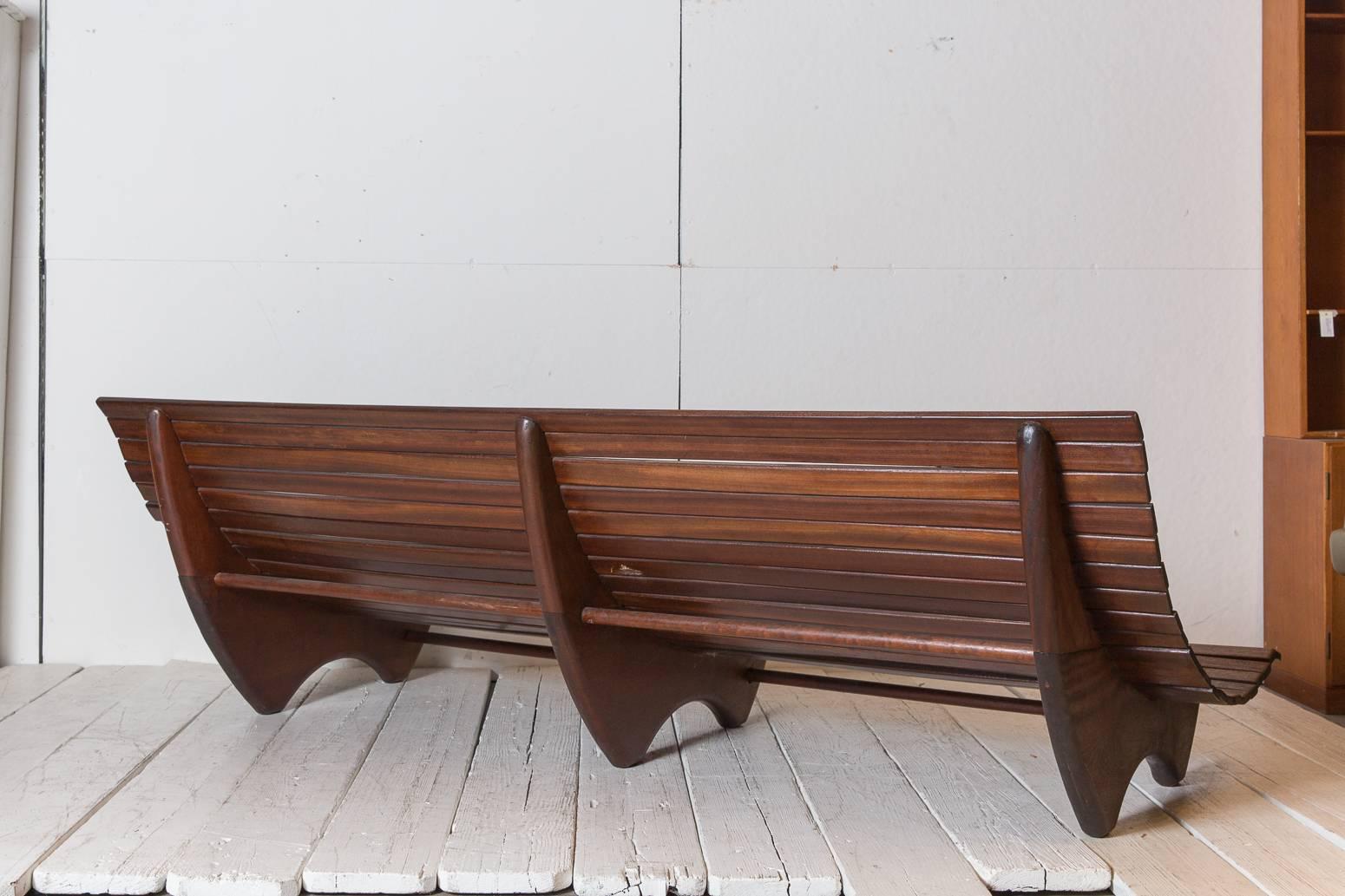 Wood Stained Brazilian Curved Slatted Bench with Three Legs In Excellent Condition In Los Angeles, CA