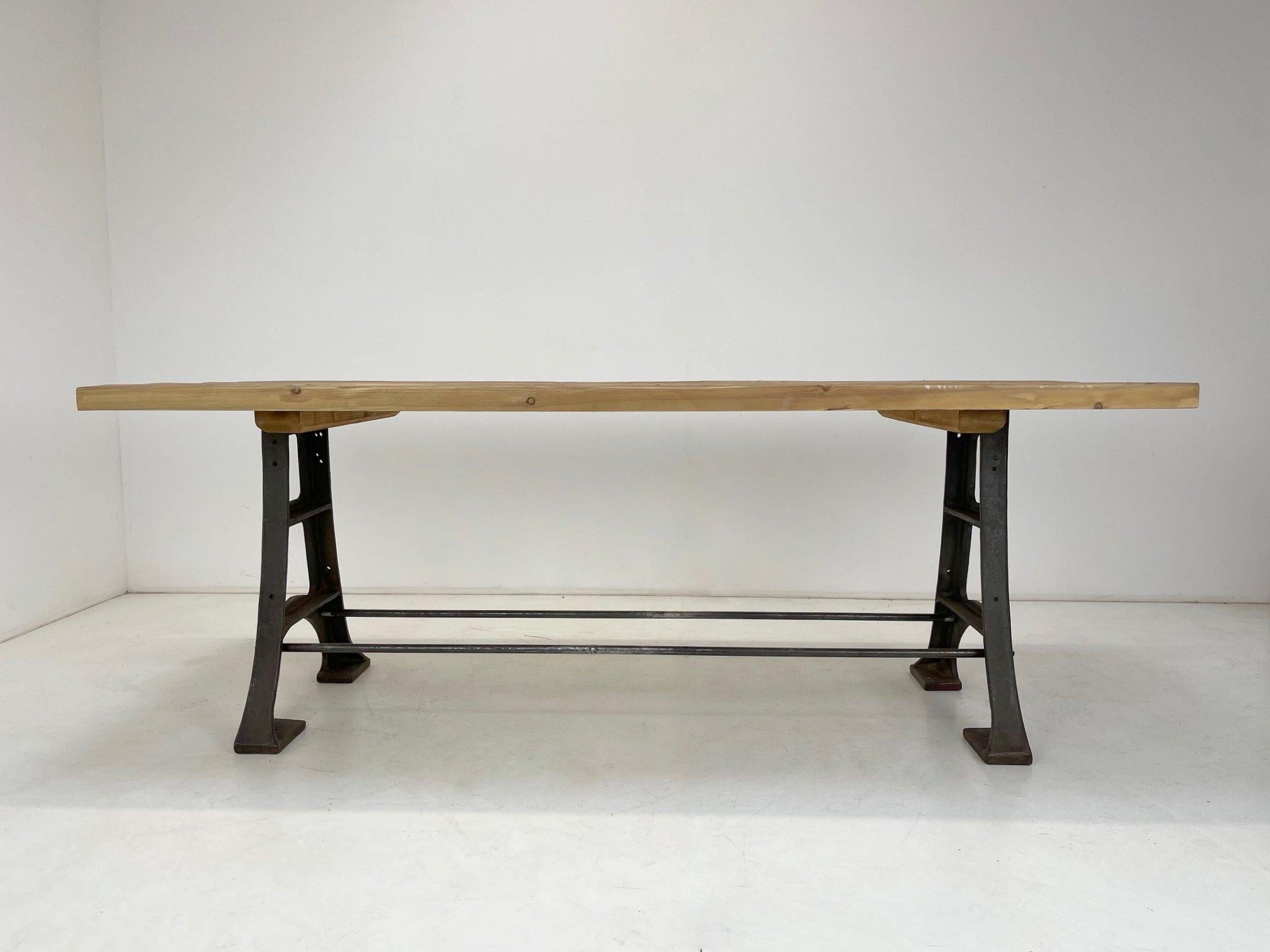 A unique table made from an original vintage factory table with a new solid recycled wood top will give any interior an original touch.