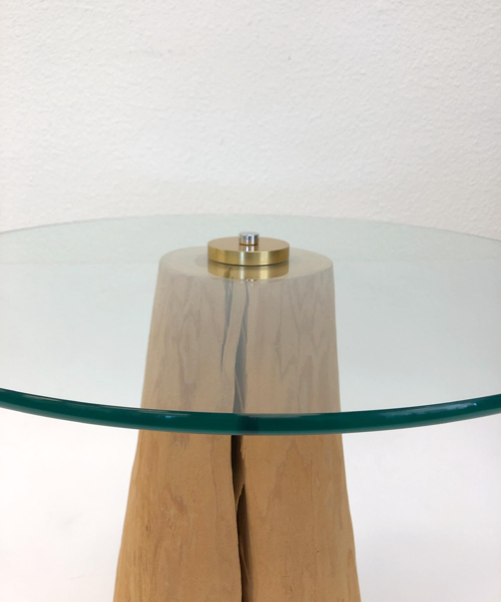 A beautiful 1970s wood stump with a round glass top side table by Michele Taylor. The table is in original condition. The hardware that holds the 3/8” thick glass top to the stump is chrome and gold.
Dimension: 24” diameter, 18.25” high.