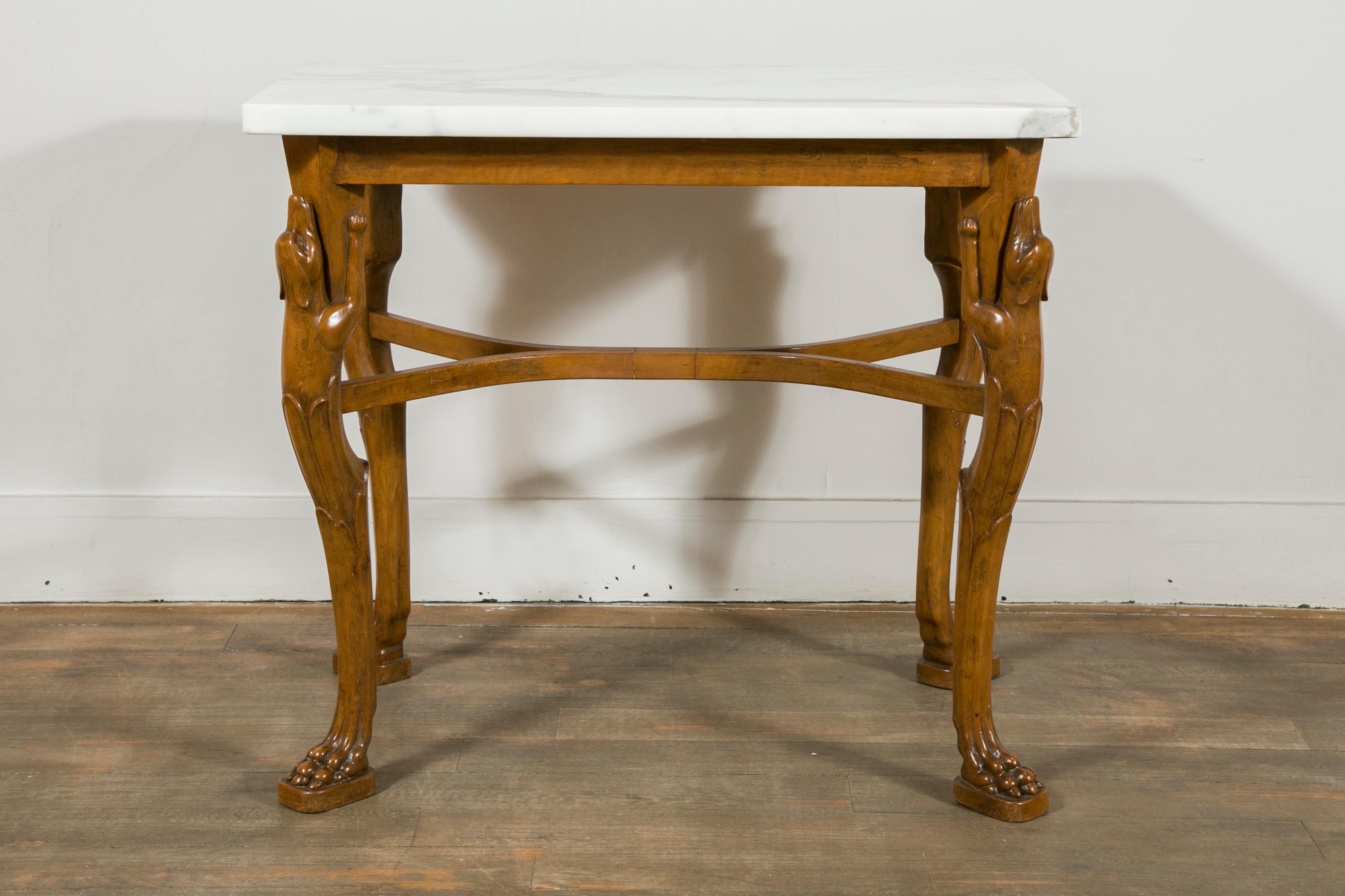 A fruitwood table, with Calacatta marble top
The table can be used as a console, desk or occasional table
The design of this table is directly inspired by a claw-footed bronze table found in Pompeii, now in the Archeoligical Museum of Naples (see