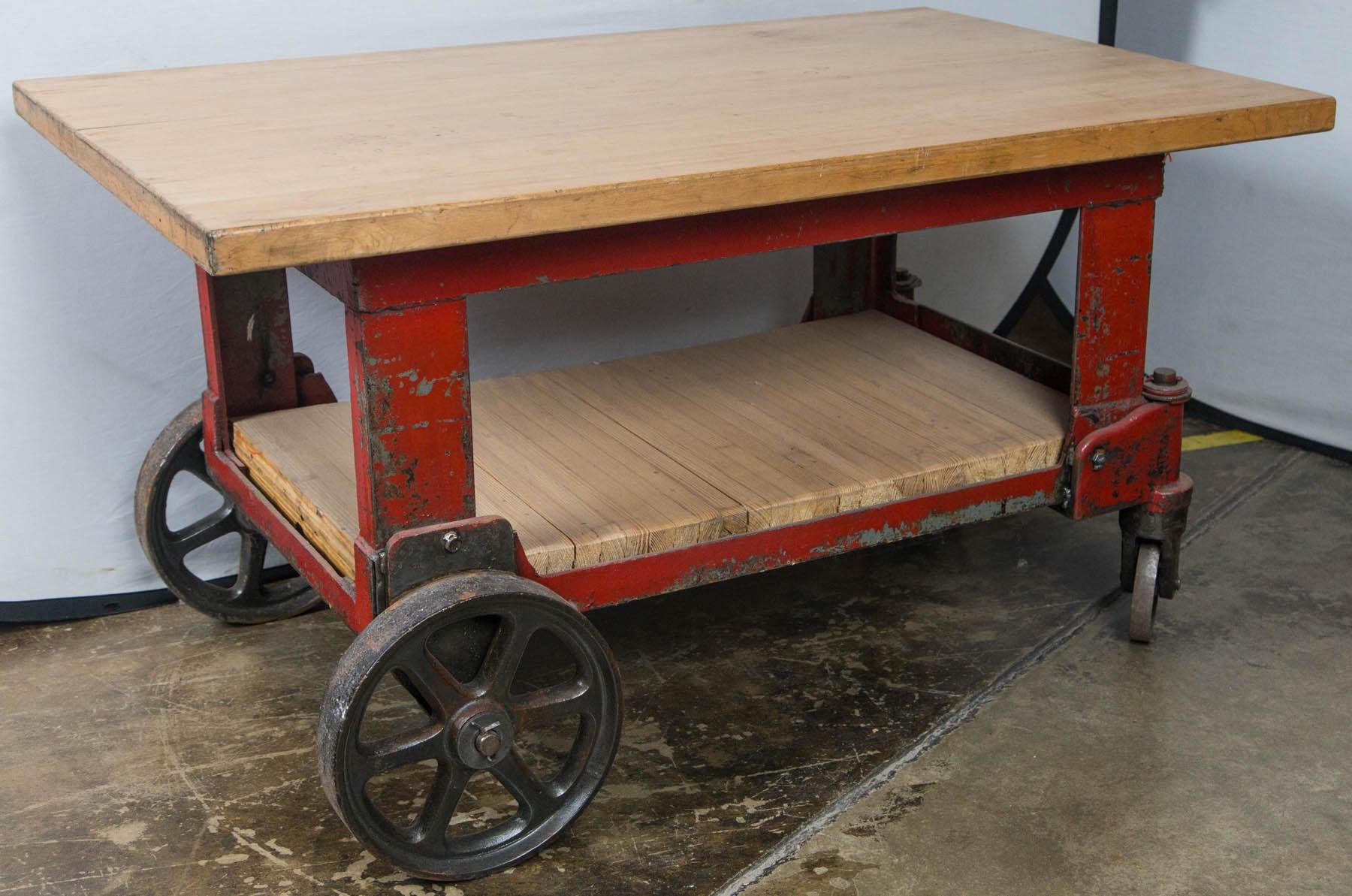 Red factory cart with steel casters.