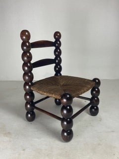 Wood turned bobbin low rush chair in the style of Charles Dudouyt, France, 1950s