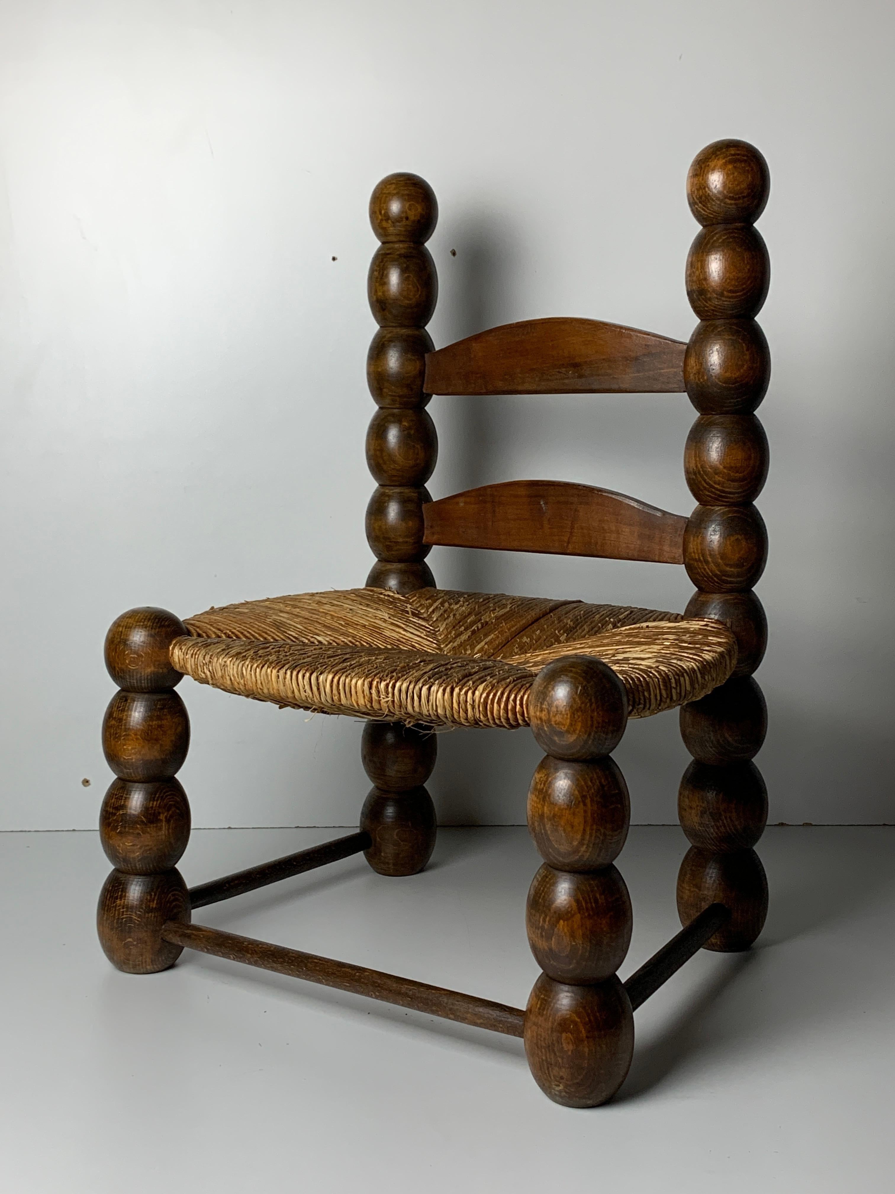 Absolutely stunning rush low chair often named in the style of Charles Dudouyt. This gorgeous little chair can be used as a low chair or kids chair and is often also placed around a fire place and would be a lovely addition to any interior. The rush