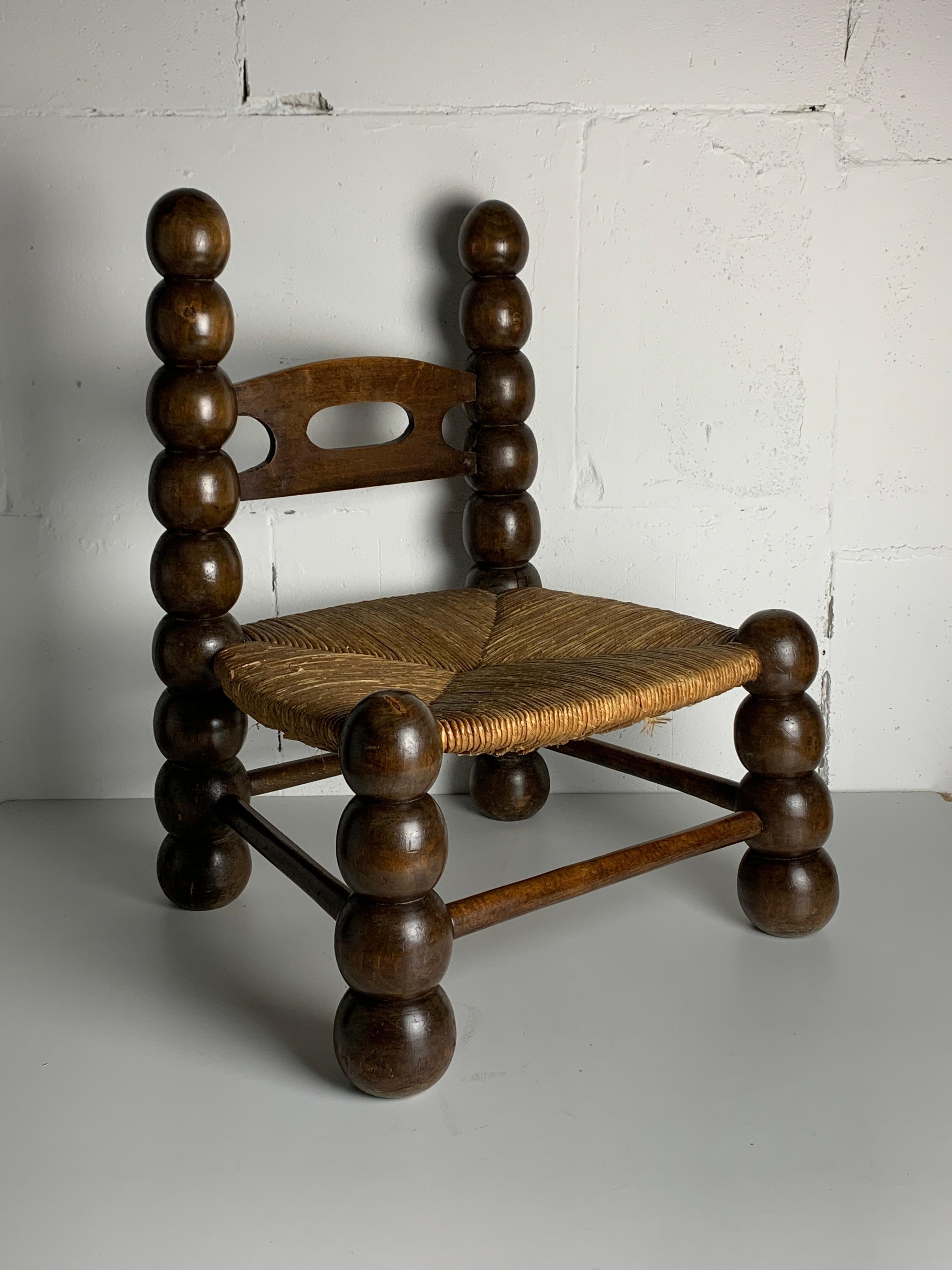Stunning rush low chair often named in the style of Charles Dudouyt. This gorgeous little chair can be used as a low chair or kids chair and is often also placed around a fire place and would be a lovely addition to any interior. The chair is in
