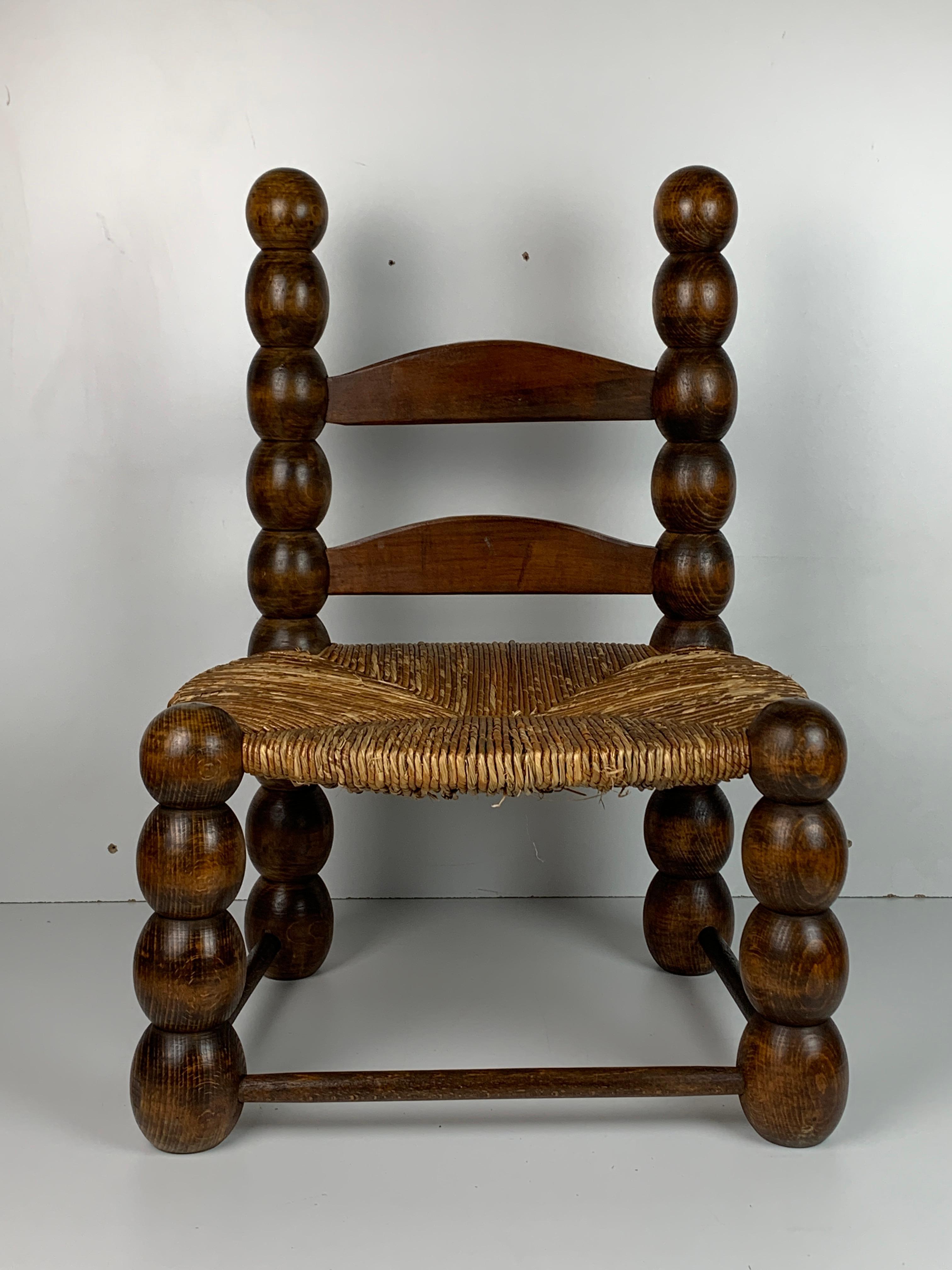 Rustic Wood Turned Bobbin Low Rush Chair in the style of Charles Dudouyt, France, 1950s