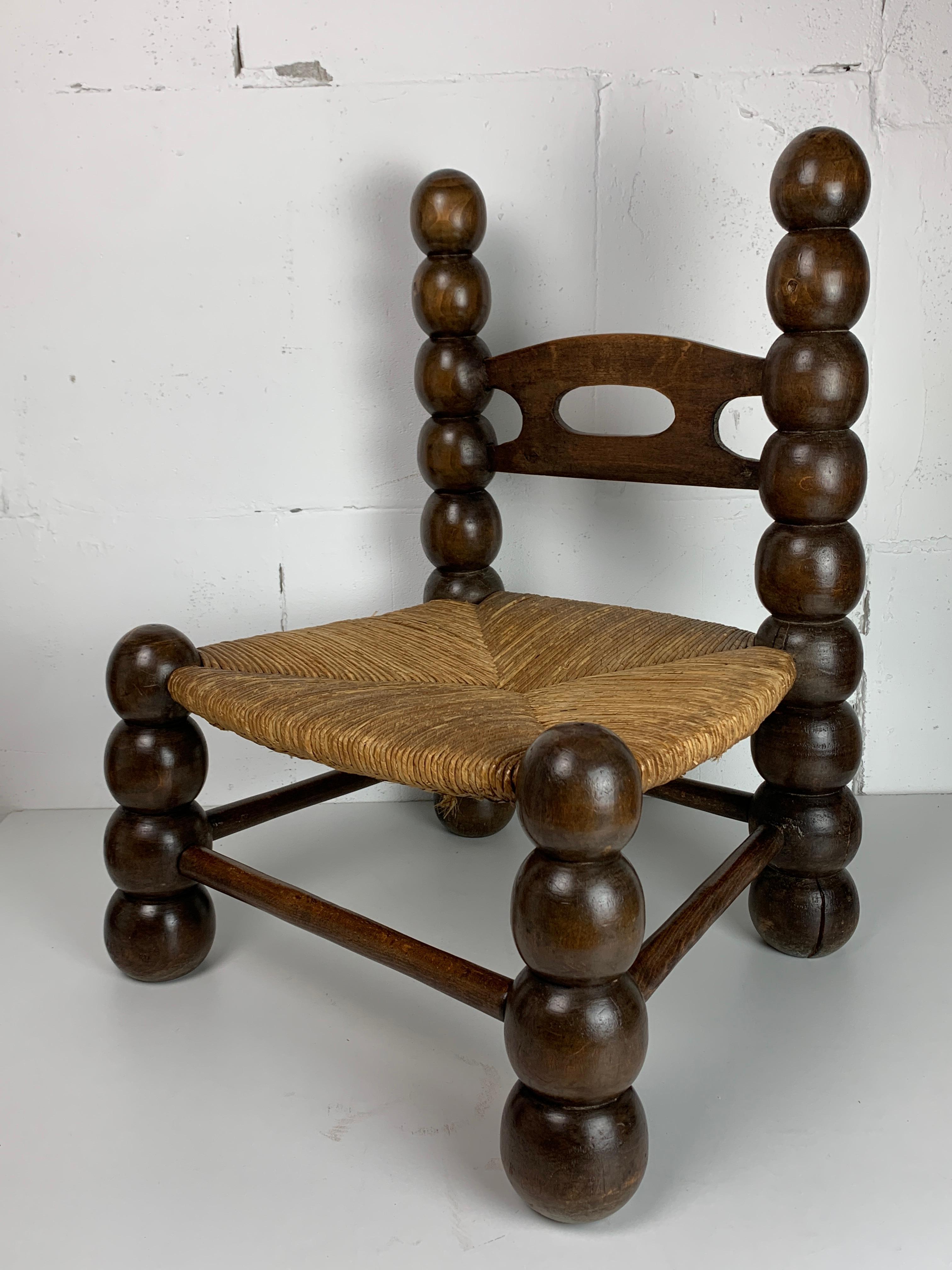 Rustic Wood Turned Bobbin Low Rush Chair in the style of Charles Dudouyt, France, 1950s