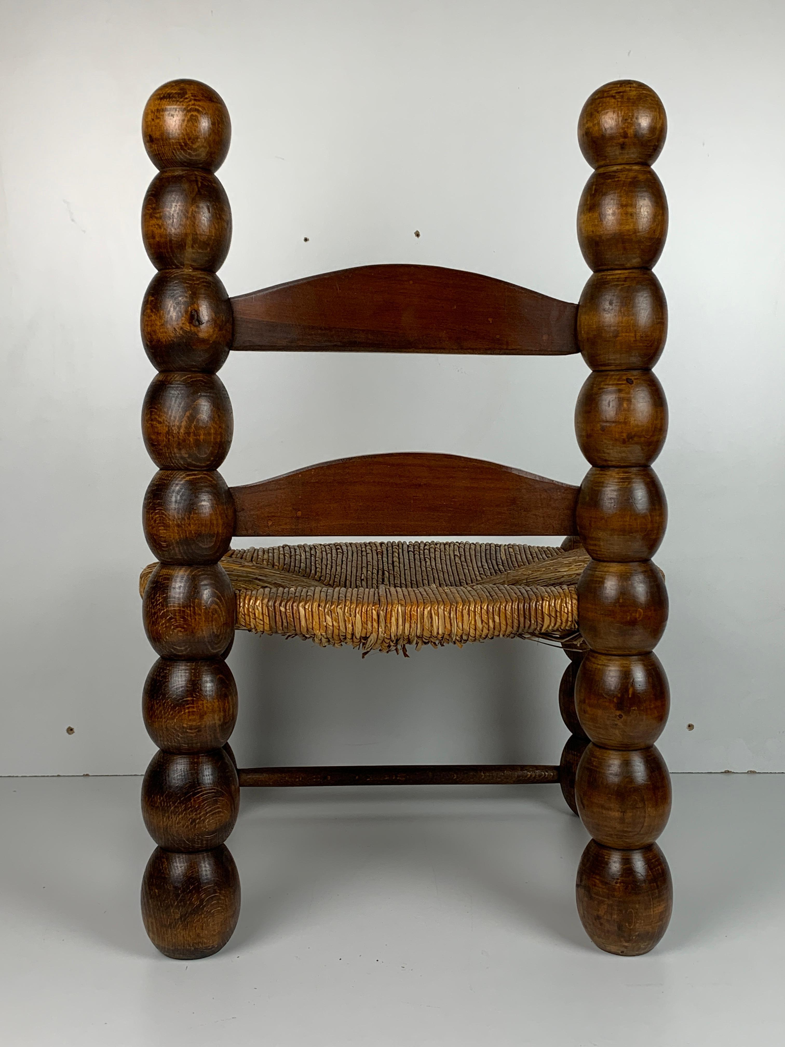 French Wood Turned Bobbin Low Rush Chair in the style of Charles Dudouyt, France, 1950s