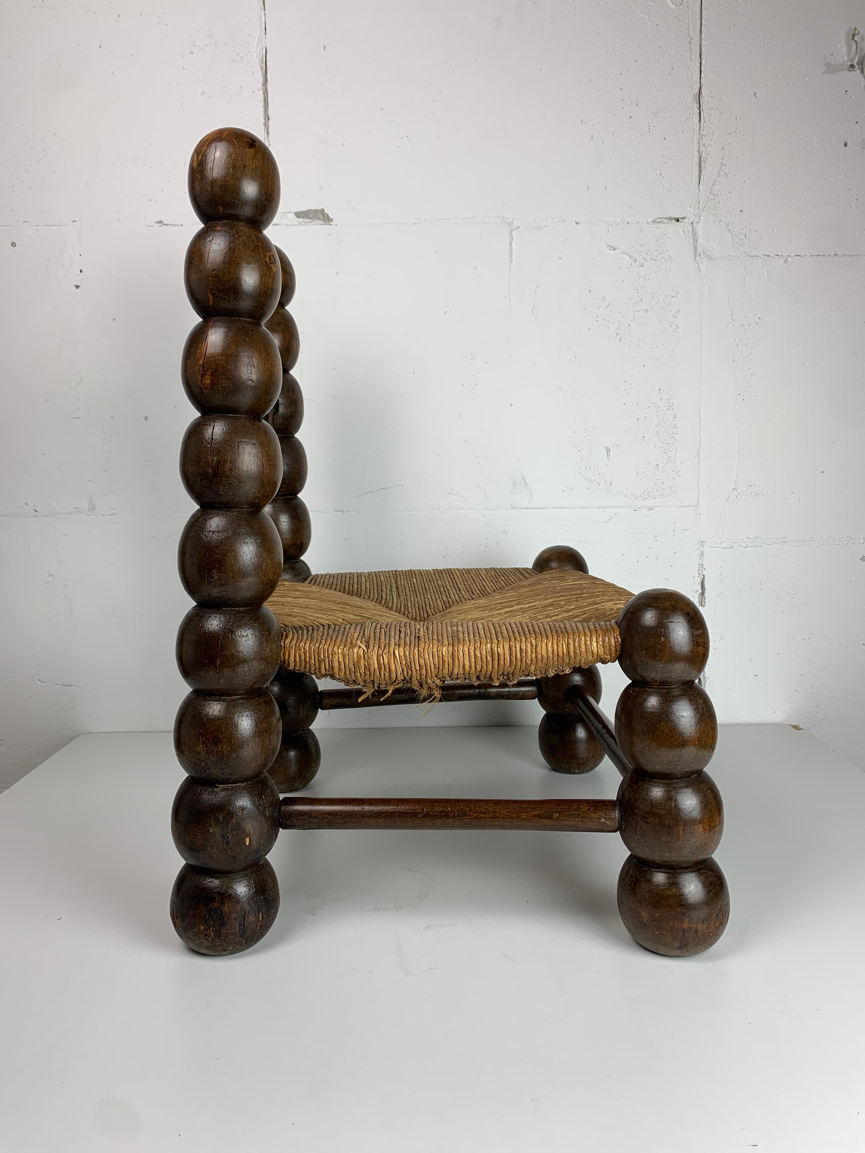 French Wood Turned Bobbin Low Rush Chair in the style of Charles Dudouyt, France, 1950s