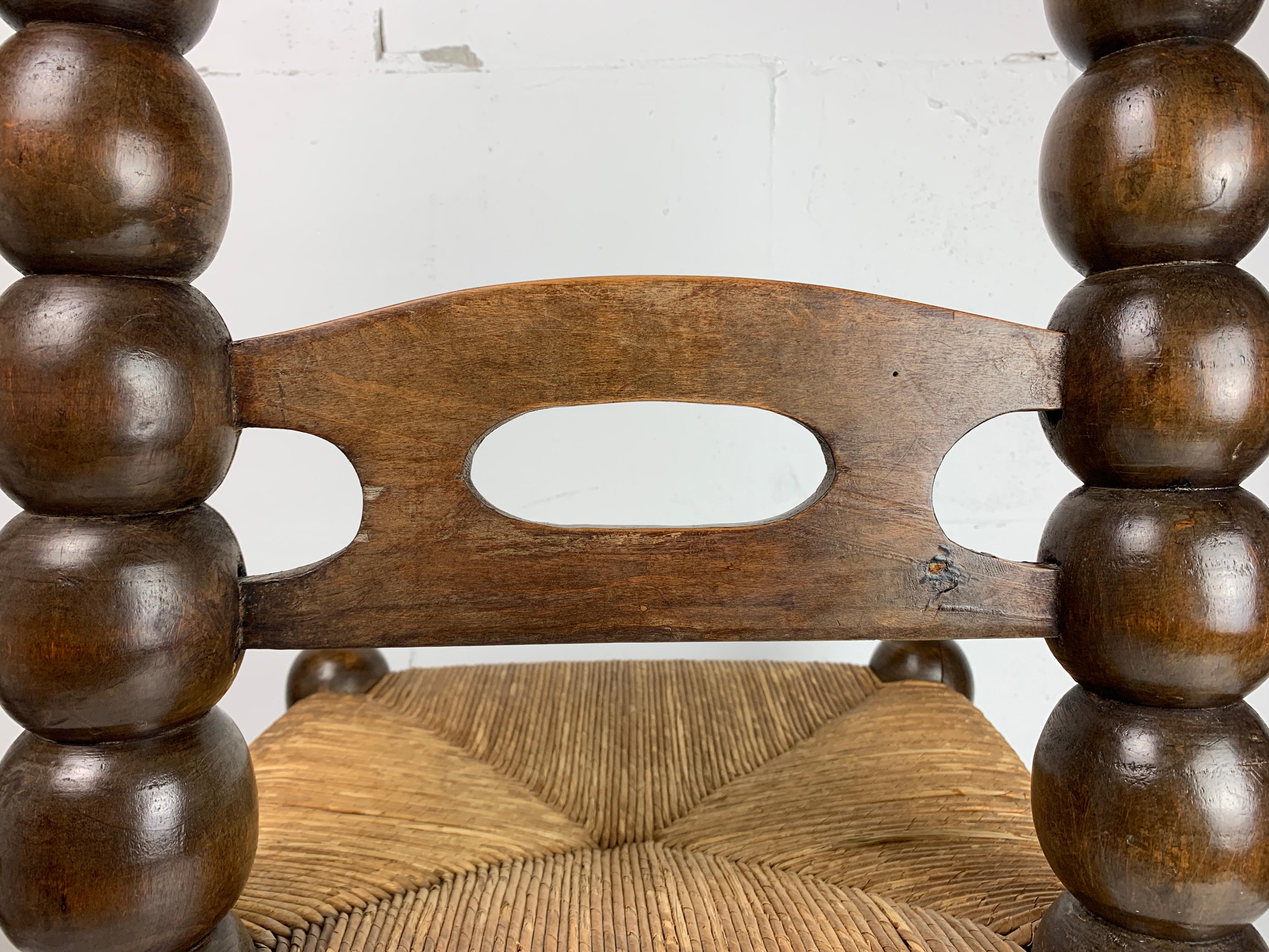 Oak Wood Turned Bobbin Low Rush Chair in the style of Charles Dudouyt, France, 1950s