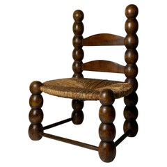 Vintage Wood Turned Bobbin Low Rush Chair in the style of Charles Dudouyt, France, 1950s